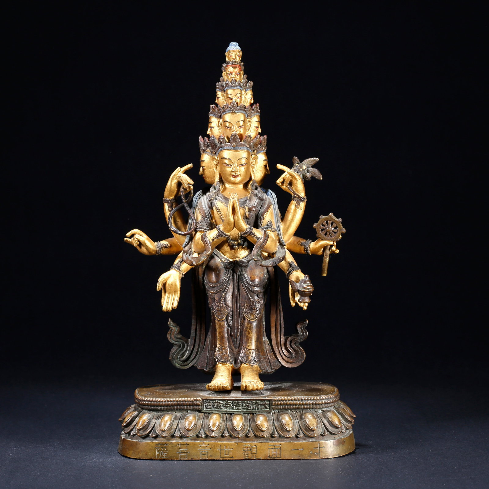 A GILT BRONZE ELEVEN-FACED SIX-ARMED BODHISATTVA STATUE (1 of 9)