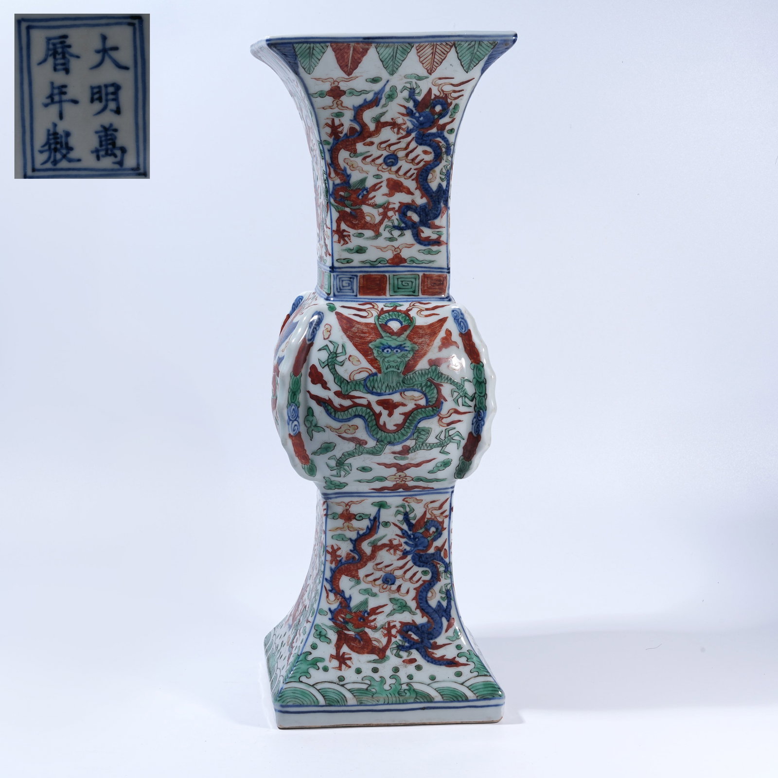 A WUCAI GU VASE WITH CLOUD-AND-DRAGON MOTIF AND FLANGED PROJECTIONS (1 of 9)