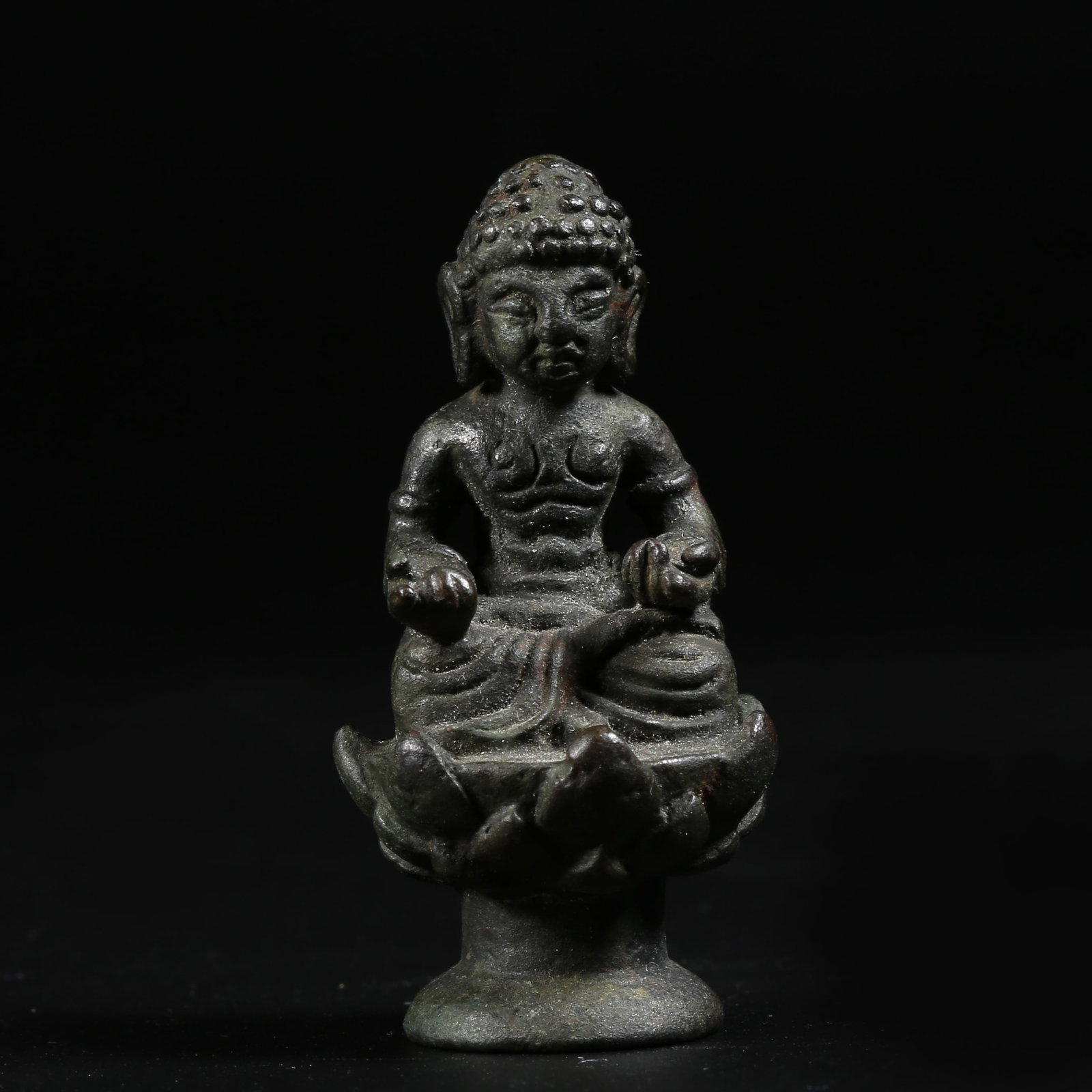 A BRONZE MINIATURE SHAKYAMUNI (1 of 8)