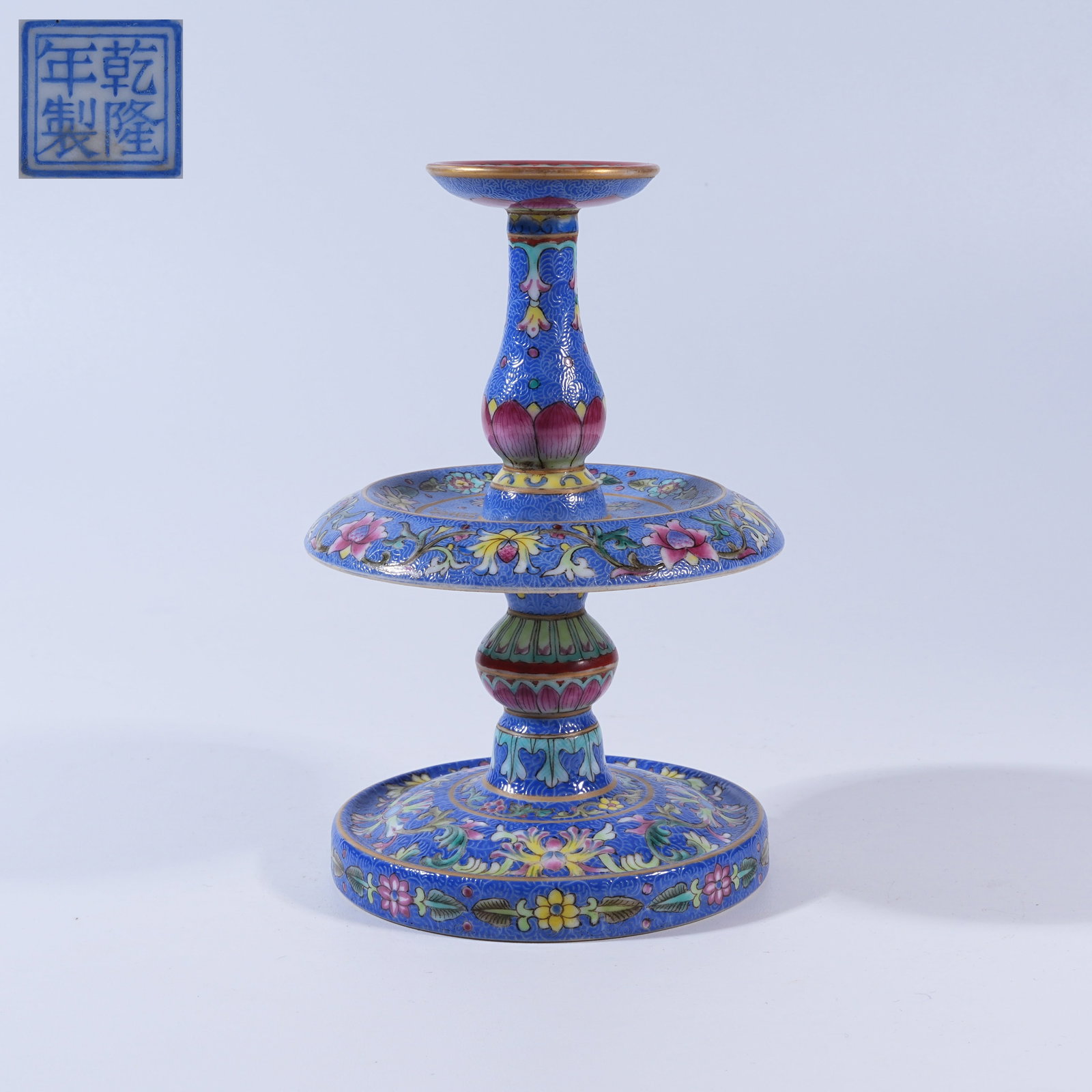 A GREEN-GROUND FAMILLE ROSE FLORAL CANDLESTICK WITH INCISED GROUND (1 of 9)