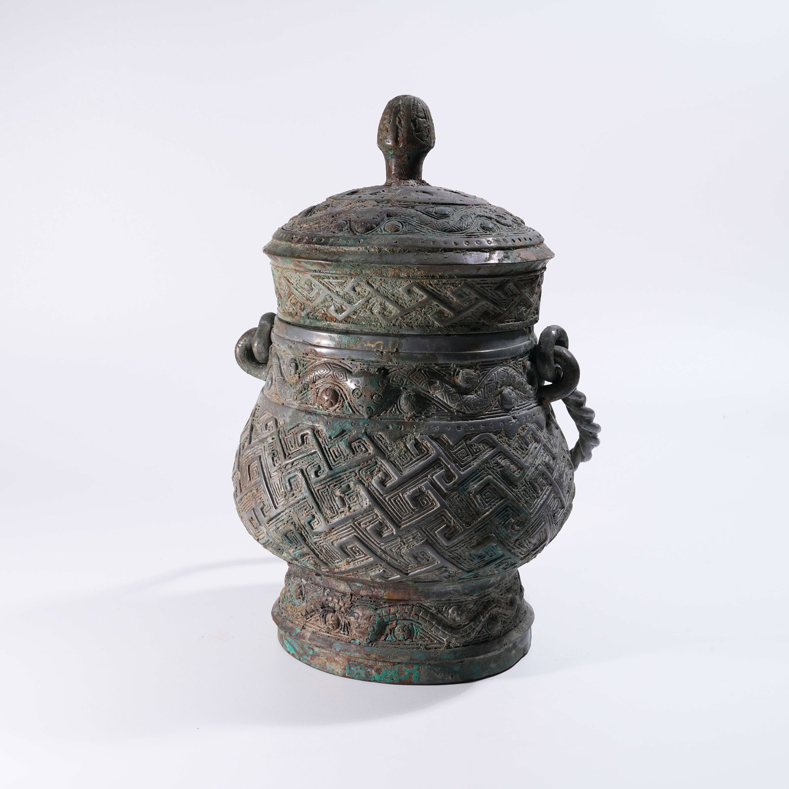 A BRONZE YOU VESSEL WITH BEAST-MASK DECORATION AND SWING HANDLE (1 of 9)