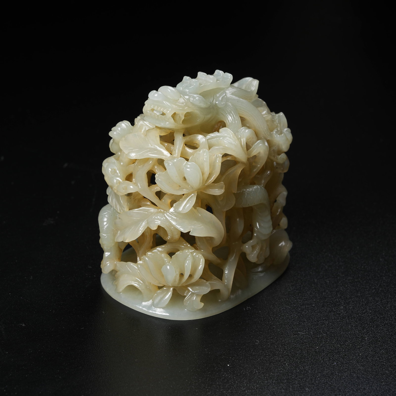 A HETIAN JADE CENSER WITH DRAGON PIERCING FLORAL PATTERN: Hetian Jade Censer with Dragon Piercing Floral Pattern