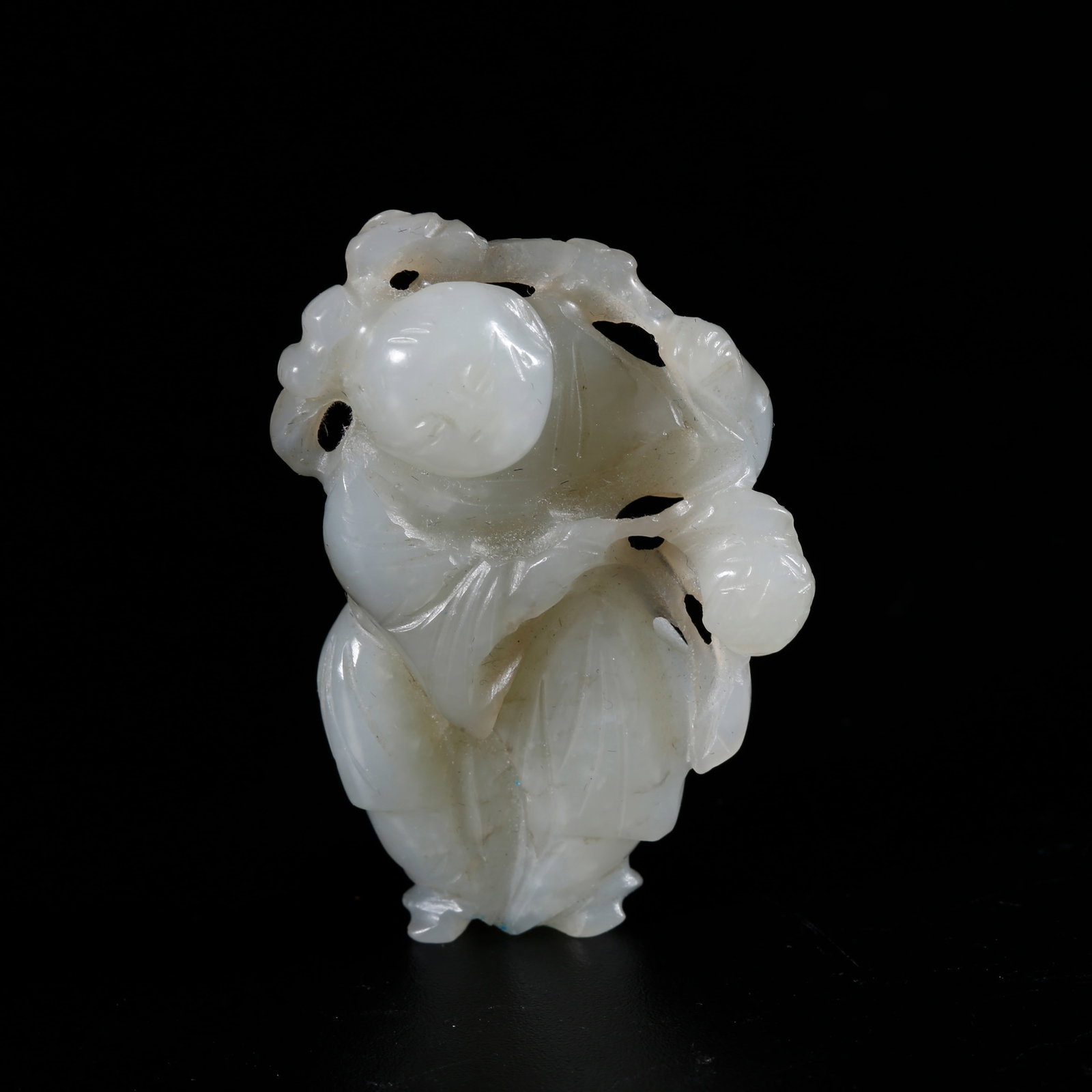 A HETIAN JADE CARVED BOY-SHAPED ORNAMENT: Hetian Jade Carved Boy-shaped Ornament