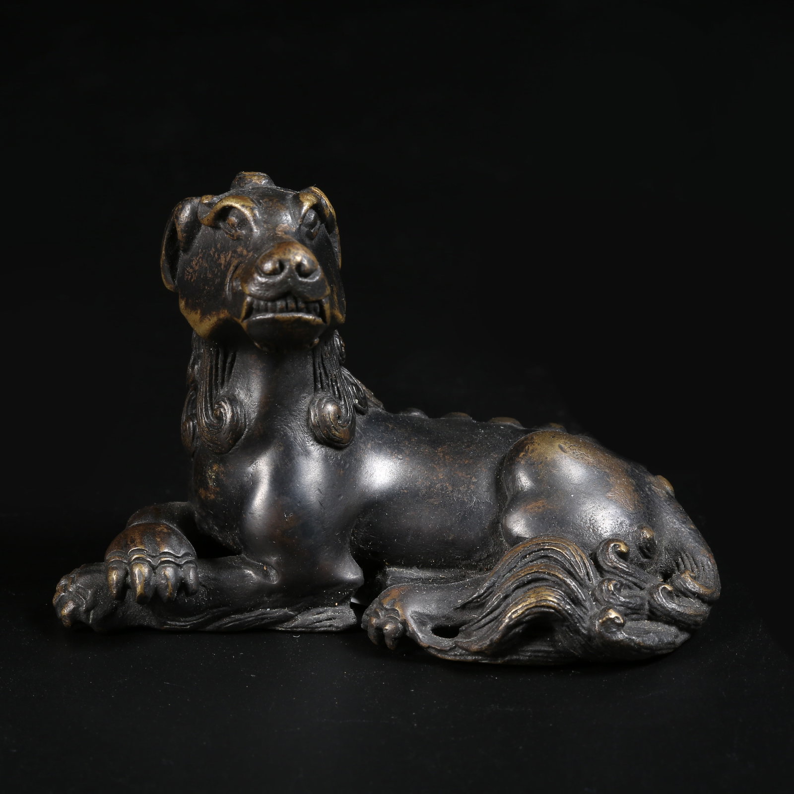A GILT-BRONZE AUSPICIOUS BEAST ORNAMENT: Gilt-Bronze Auspicious Beast Ornament