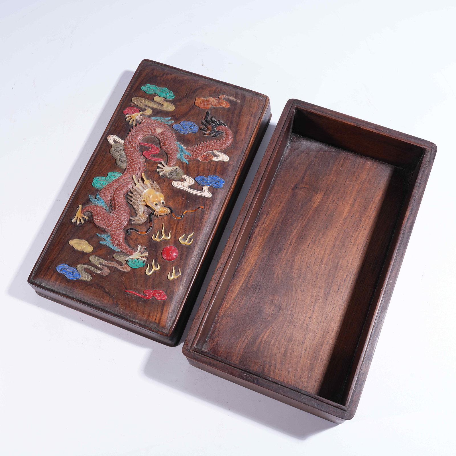 A HUANGHUALI COVERED BOX INLAID WITH "HUNDRED TREASURES" DEPICTING CLOUD AND DRAGON MOTIFS: Huanghuali Covered Box Inlaid with "Hundred Treasures" Depicting Cloud and Dragon Motifs