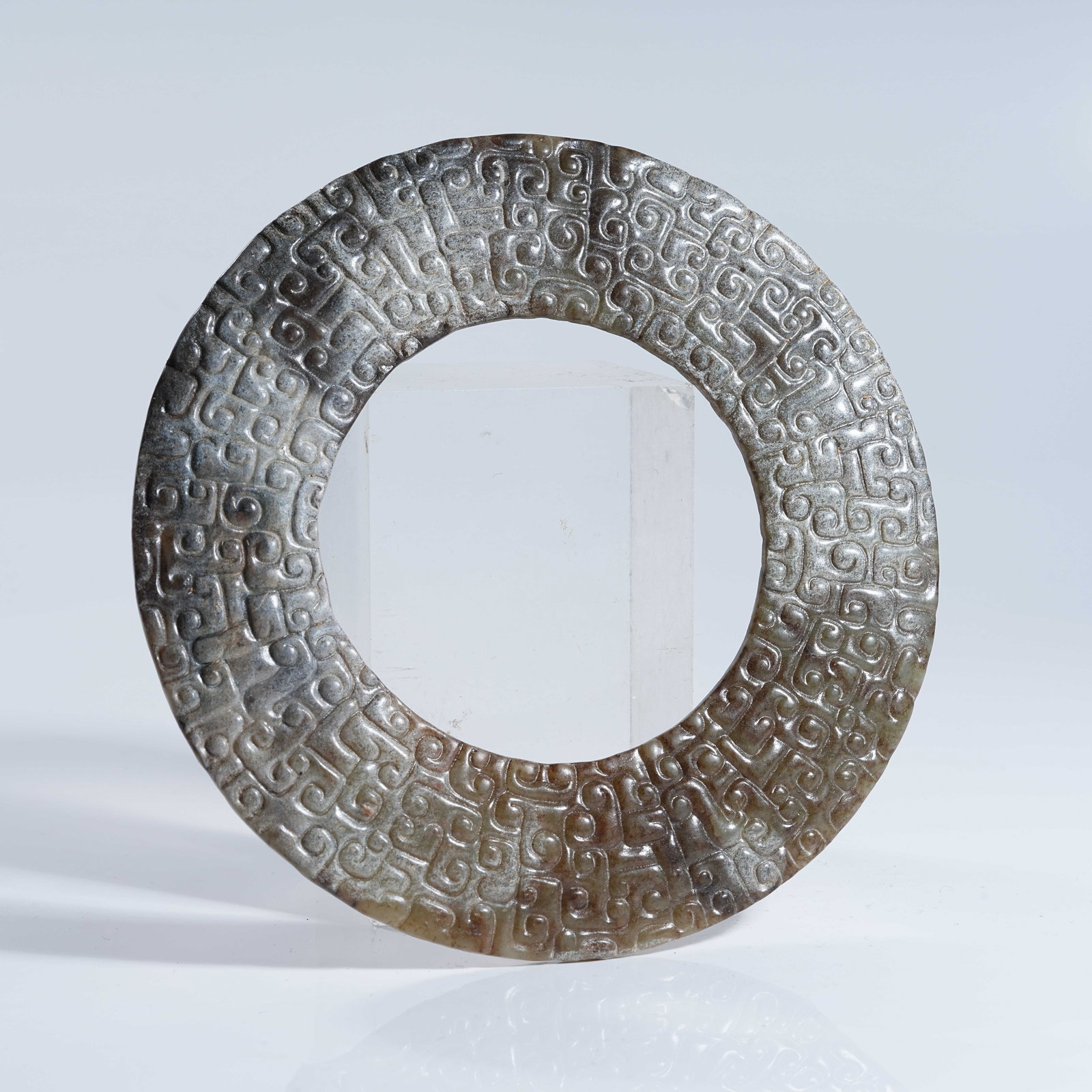A ANCIENT JADE BI WITH CURVED CLOUD PATTERN: Ancient Jade Bi with Curved Cloud Pattern