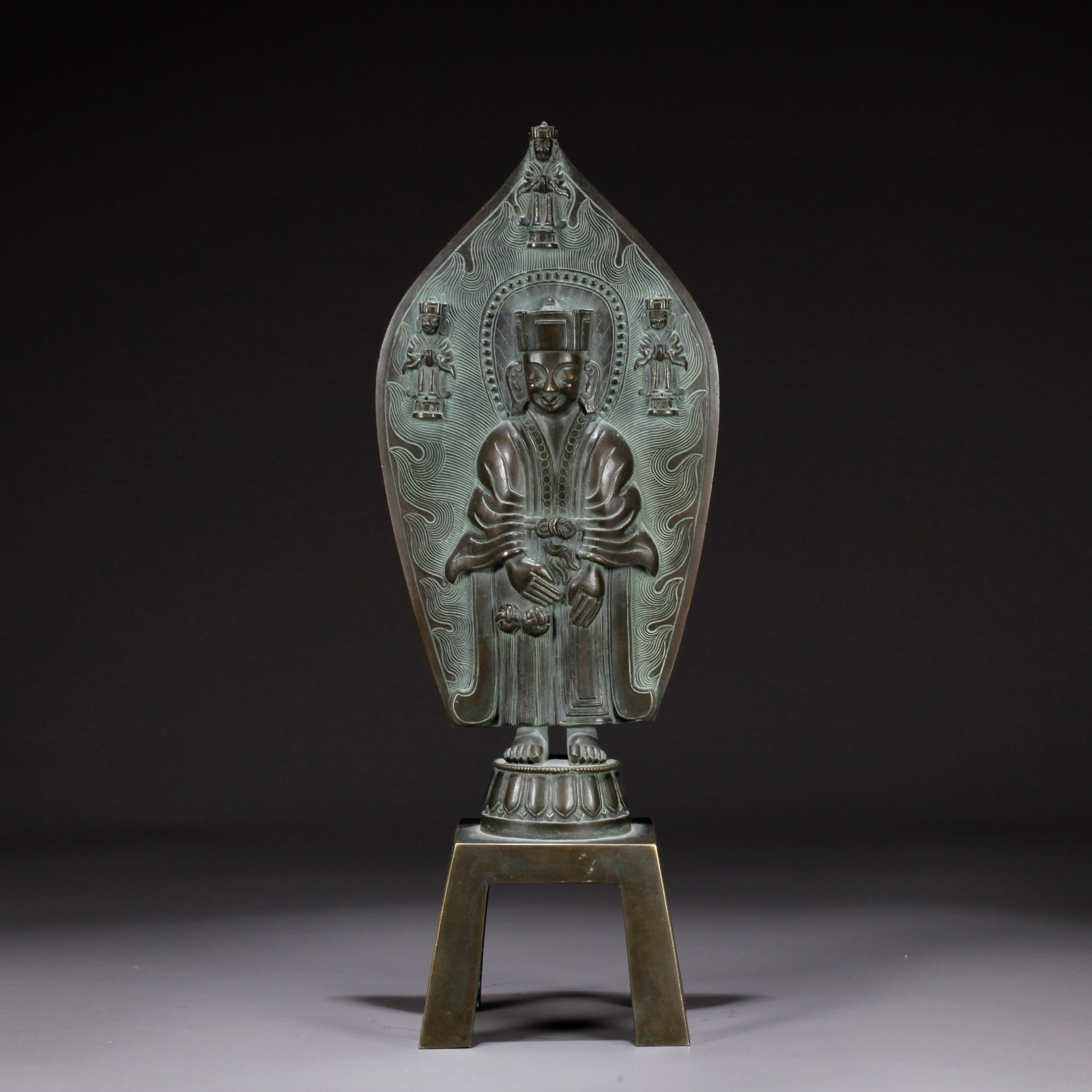 A BRONZE FIGURINE WITH HUMAN MOTIF (1 of 9)