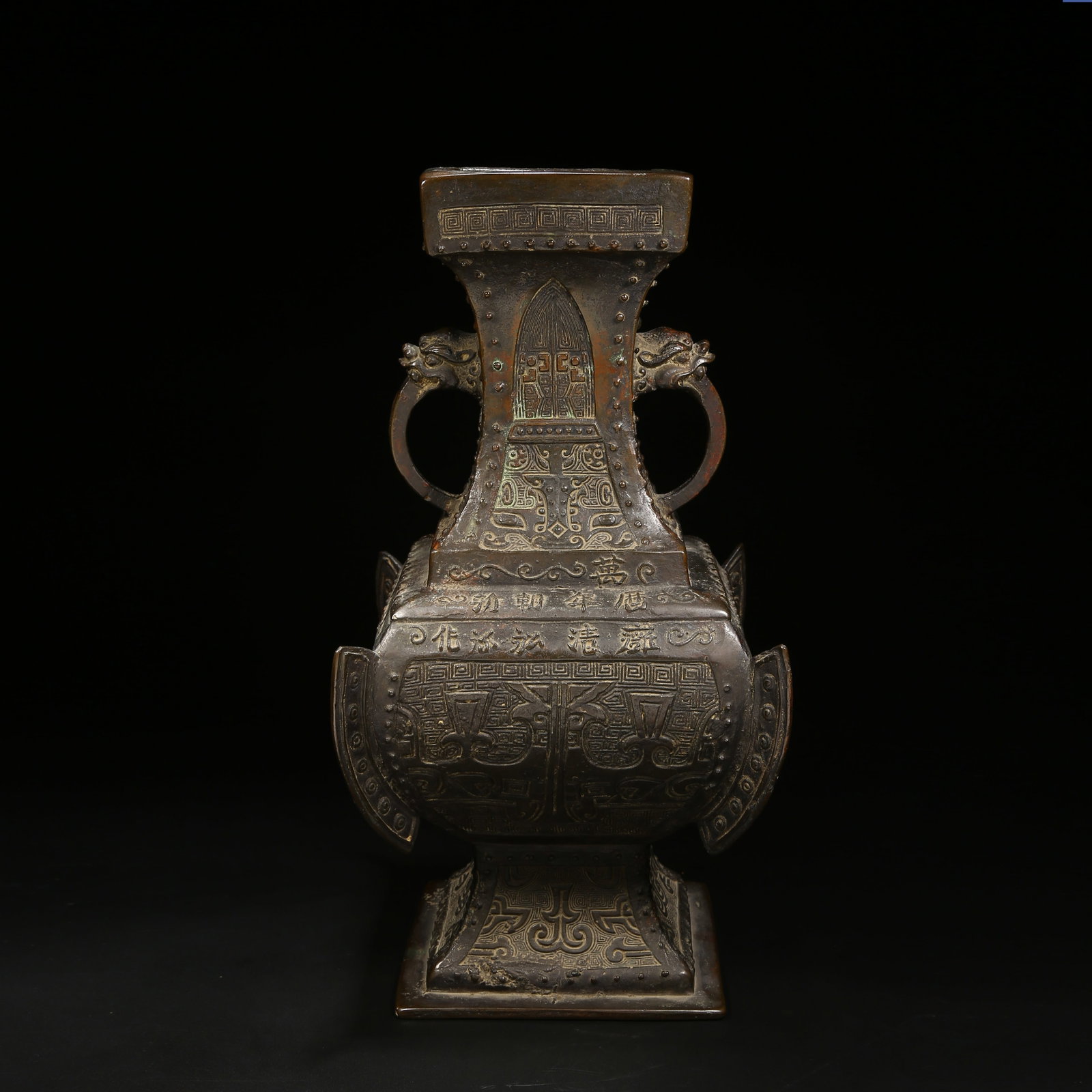 A BRONZE SQUARE VASE WITH BEAST-FACE PATTERN, FLANGES, AND BEAST-HEAD HANDLES (1 of 9)