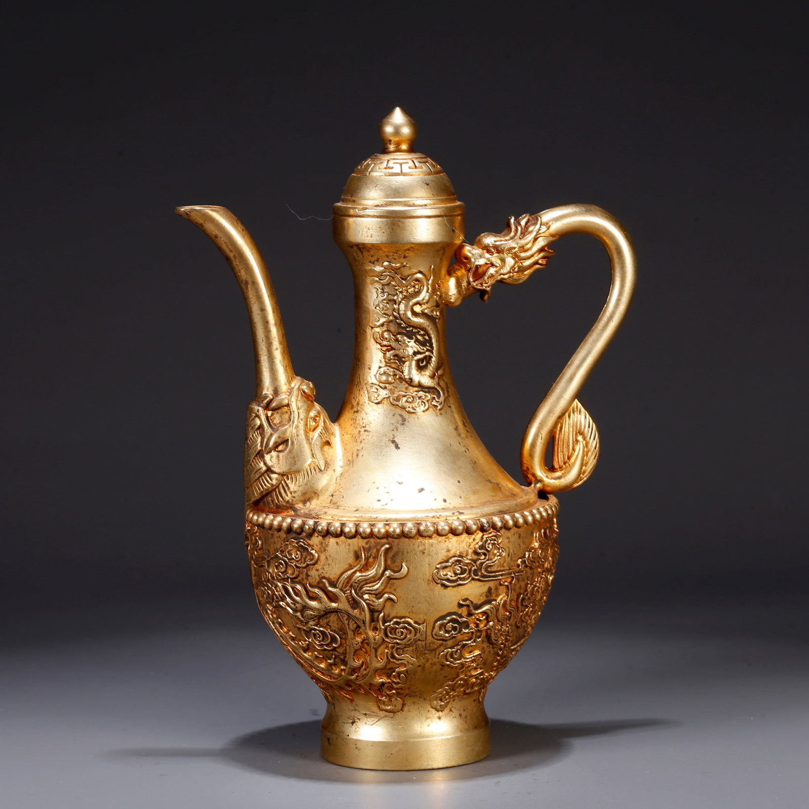 A GILT BRONZE EWER WITH DRAGON MOTIF: Gilt bronze ewer with dragon motif