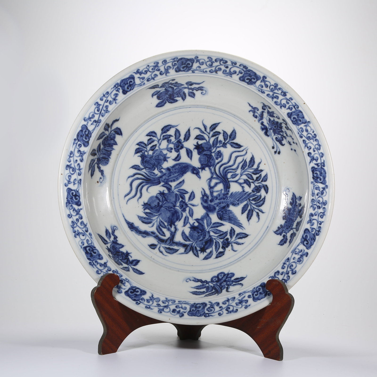 A BLUE-AND-WHITE LARGE FOLDED-RIM PLATE WITH PHOENIX AND FLORAL PATTERN (1 of 9)