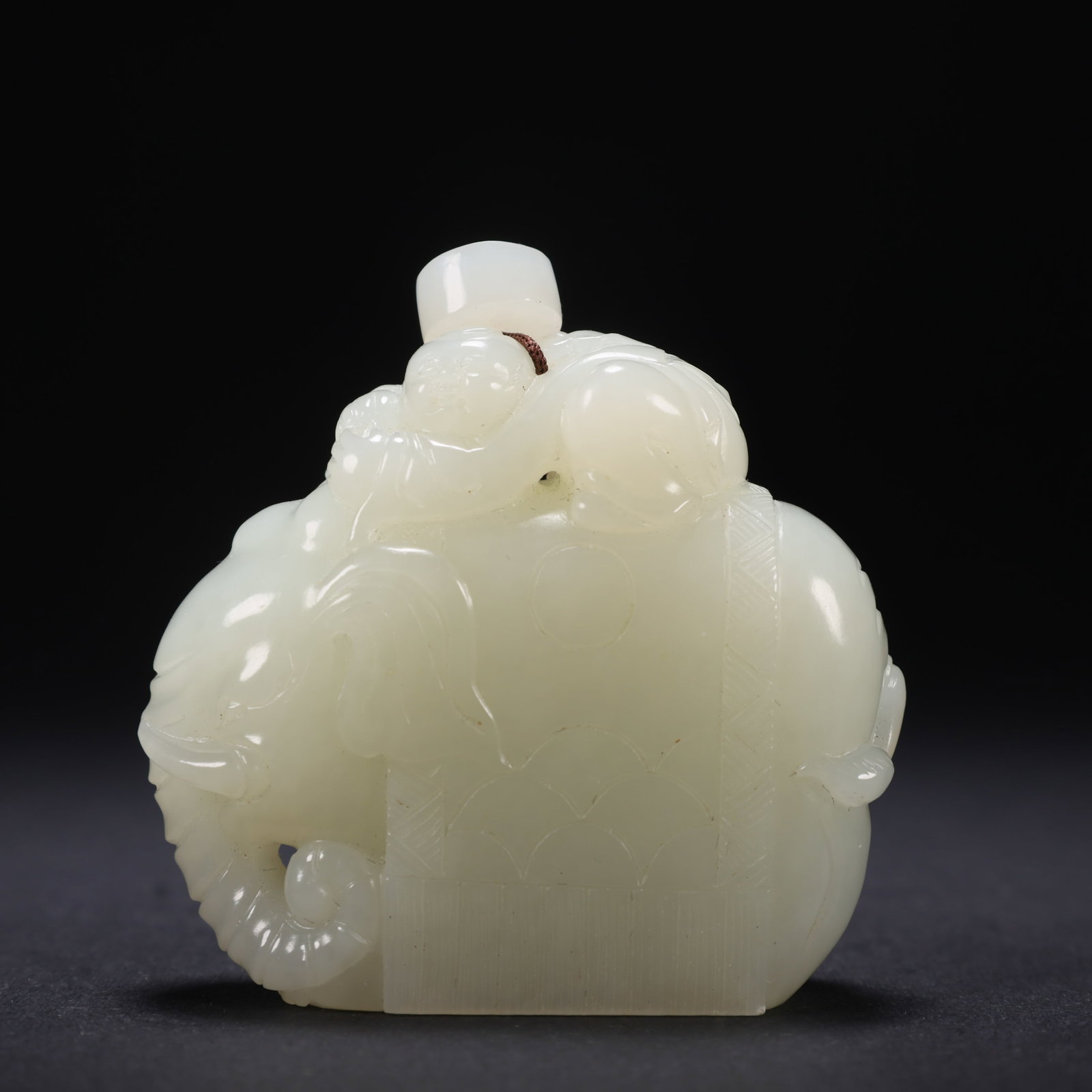 A HETIAN JADE CHILD PLAYING WITH ELEPHANT (1 of 9)