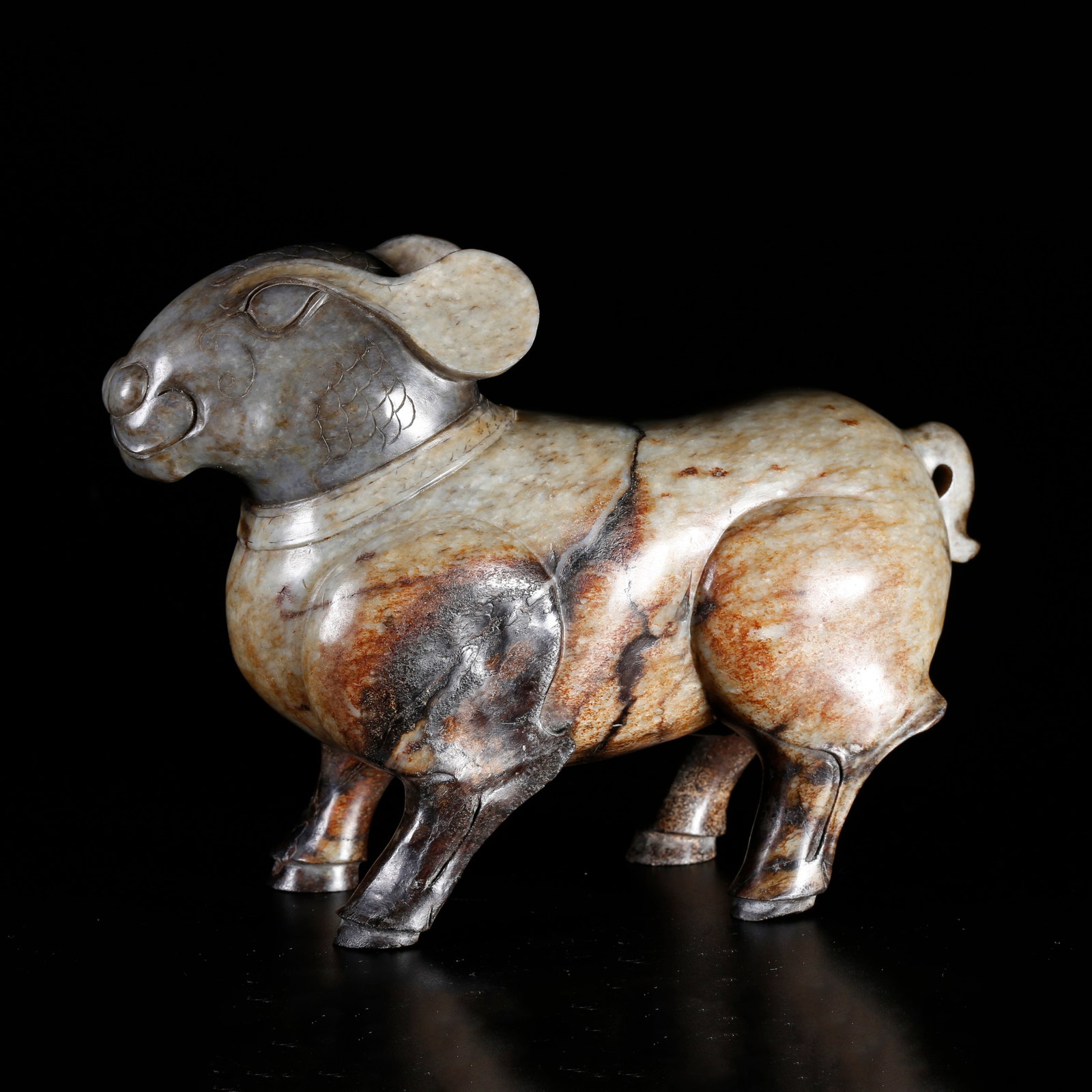 A HETIAN JADE CARVED ANIMAL-SHAPED ORNAMENT (1 of 10)
