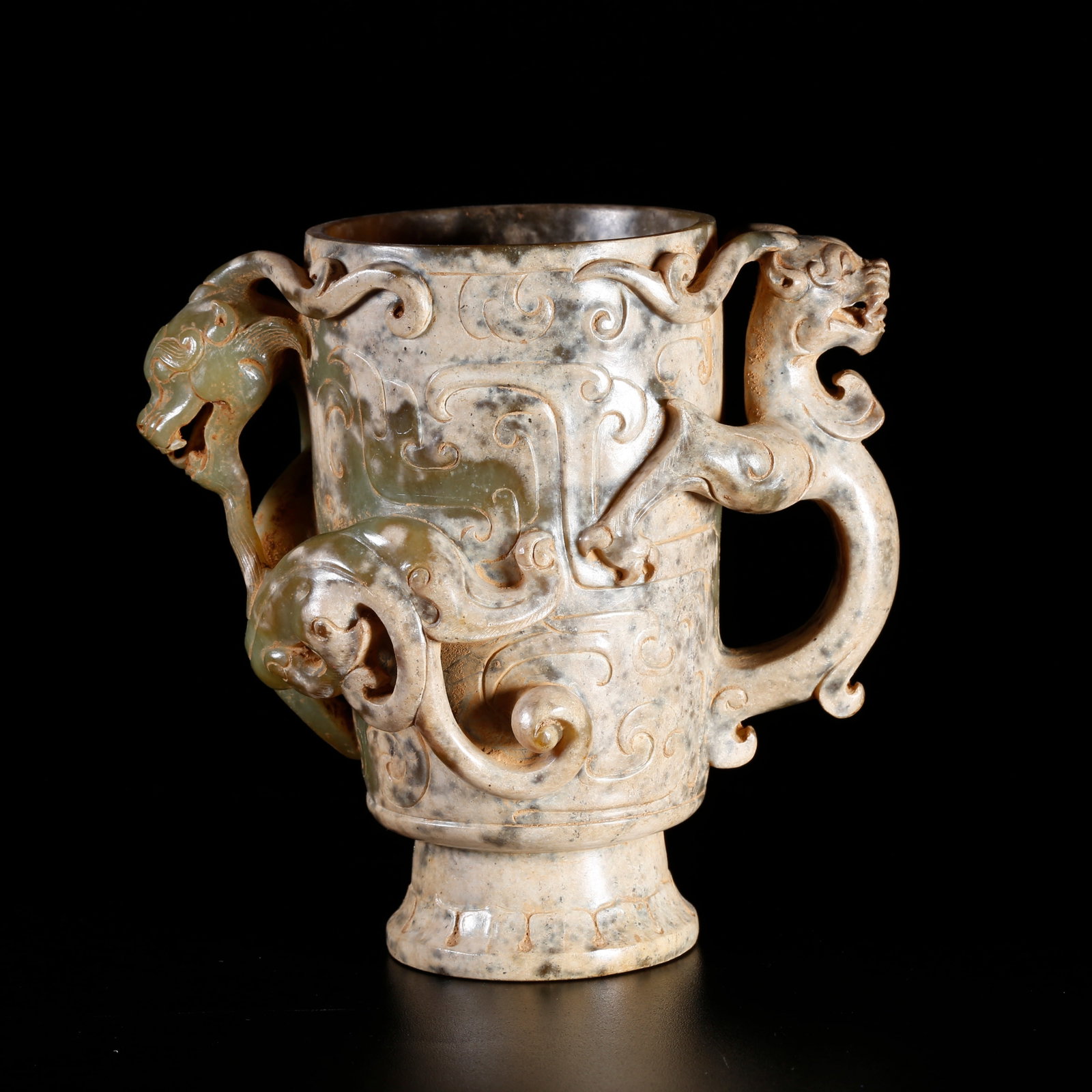 A ARCHAIC JADE CARVED CUP WITH DRAGON MOTIF: Archaic jade carved cup with dragon motif