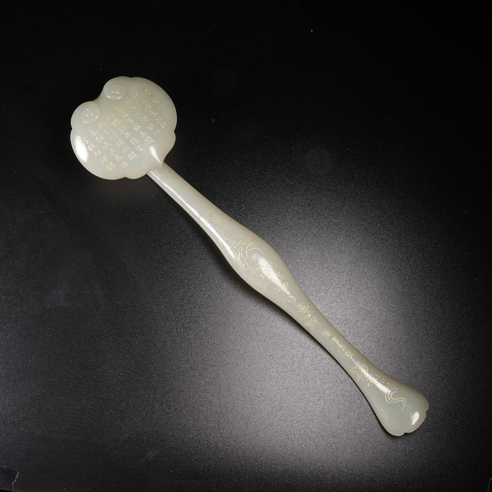 A HETIAN JADE GILT-DECORATED RUYI SCEPTER IN THE FORM OF LINGZHI: Hetian Jade Gilt-Decorated Ruyi Scepter in the Form of Lingzhi