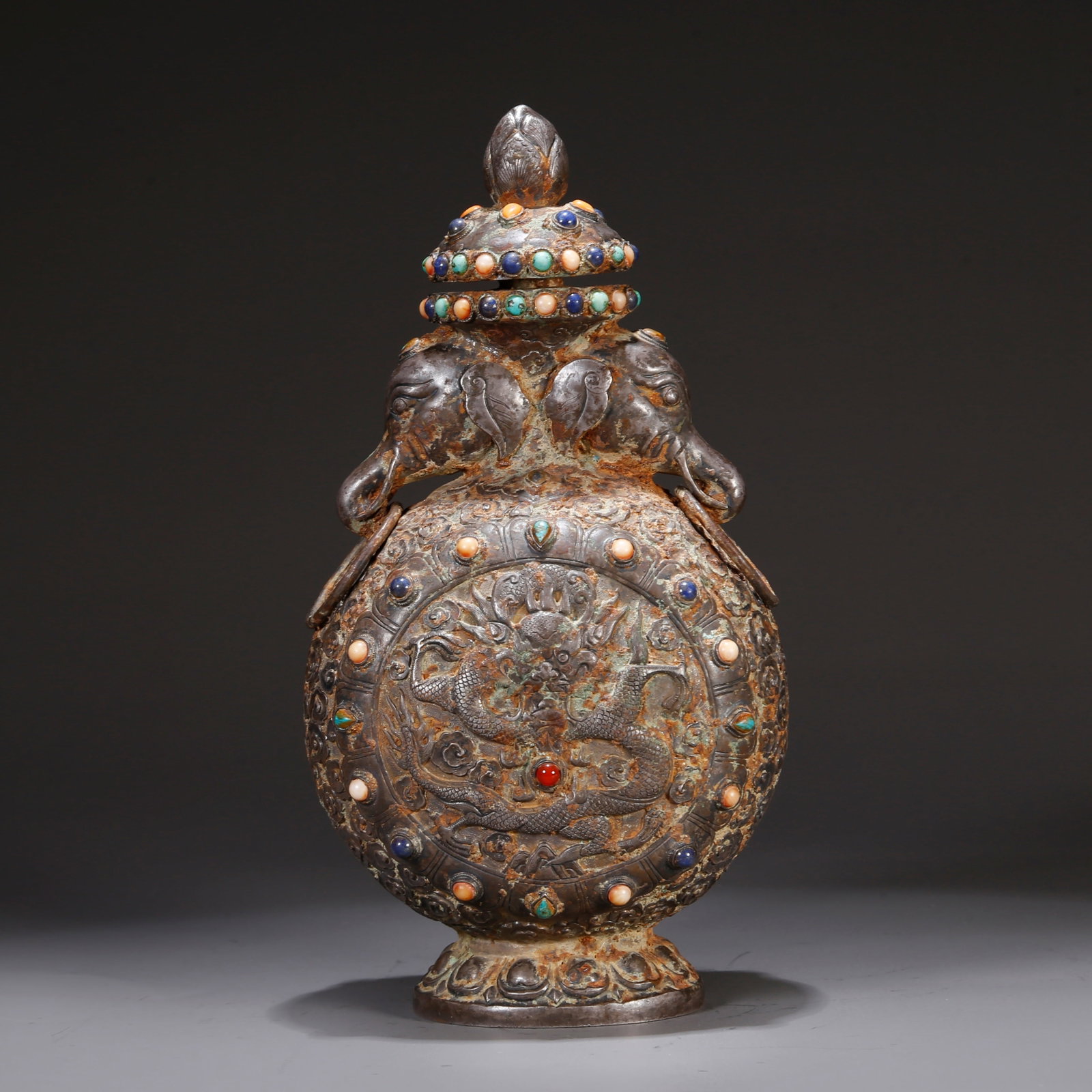 A SILVER LIDDED BOTTLE WITH CLOUD AND DRAGON MOTIF (1 of 10)