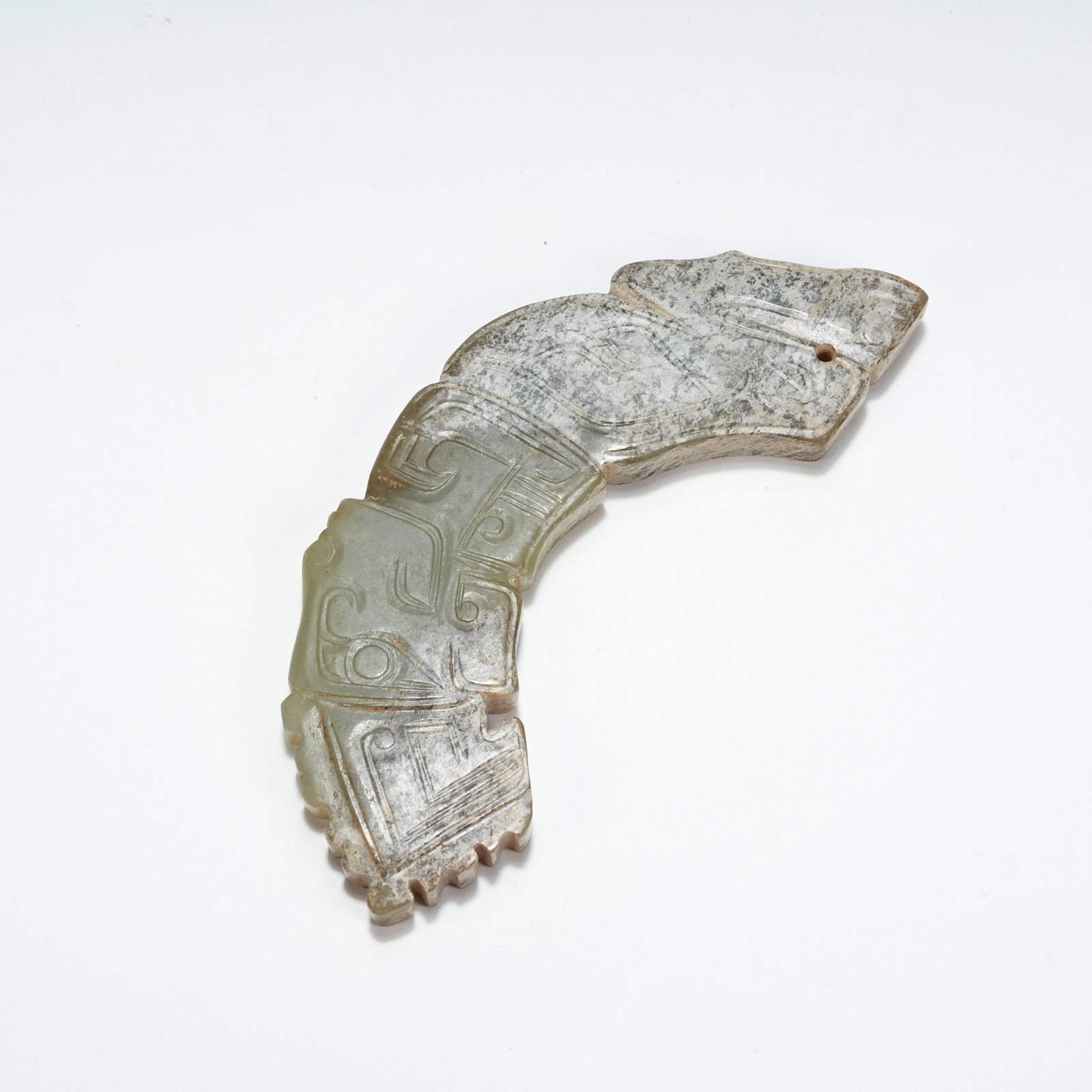 A ARCHAIC JADE DRAGON-HEAD HUANG PENDANT: Archaic jade dragon-head huang pendant