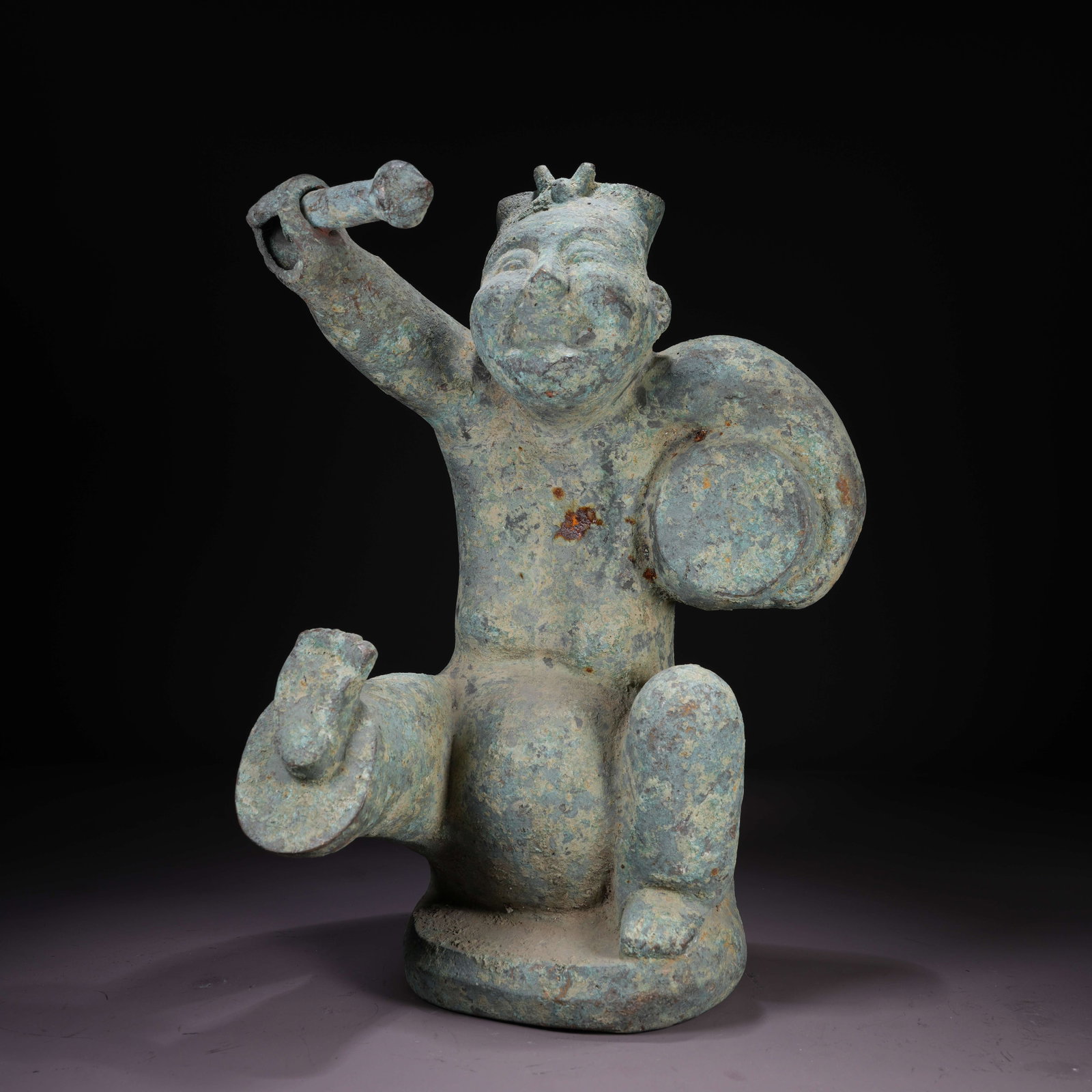 A BRONZE FIGURINE OF DRUMMING BOY: Bronze Figurine of Drumming Boy