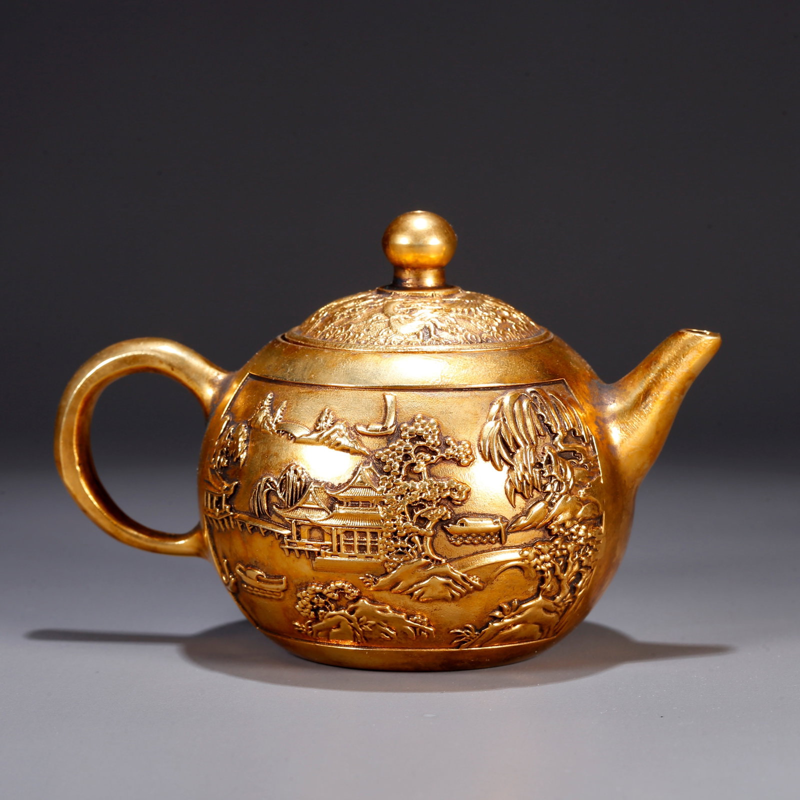 A GILT BRONZE EWER WITH LANDSCAPE AND PAVILION DESIGN (1 of 9)