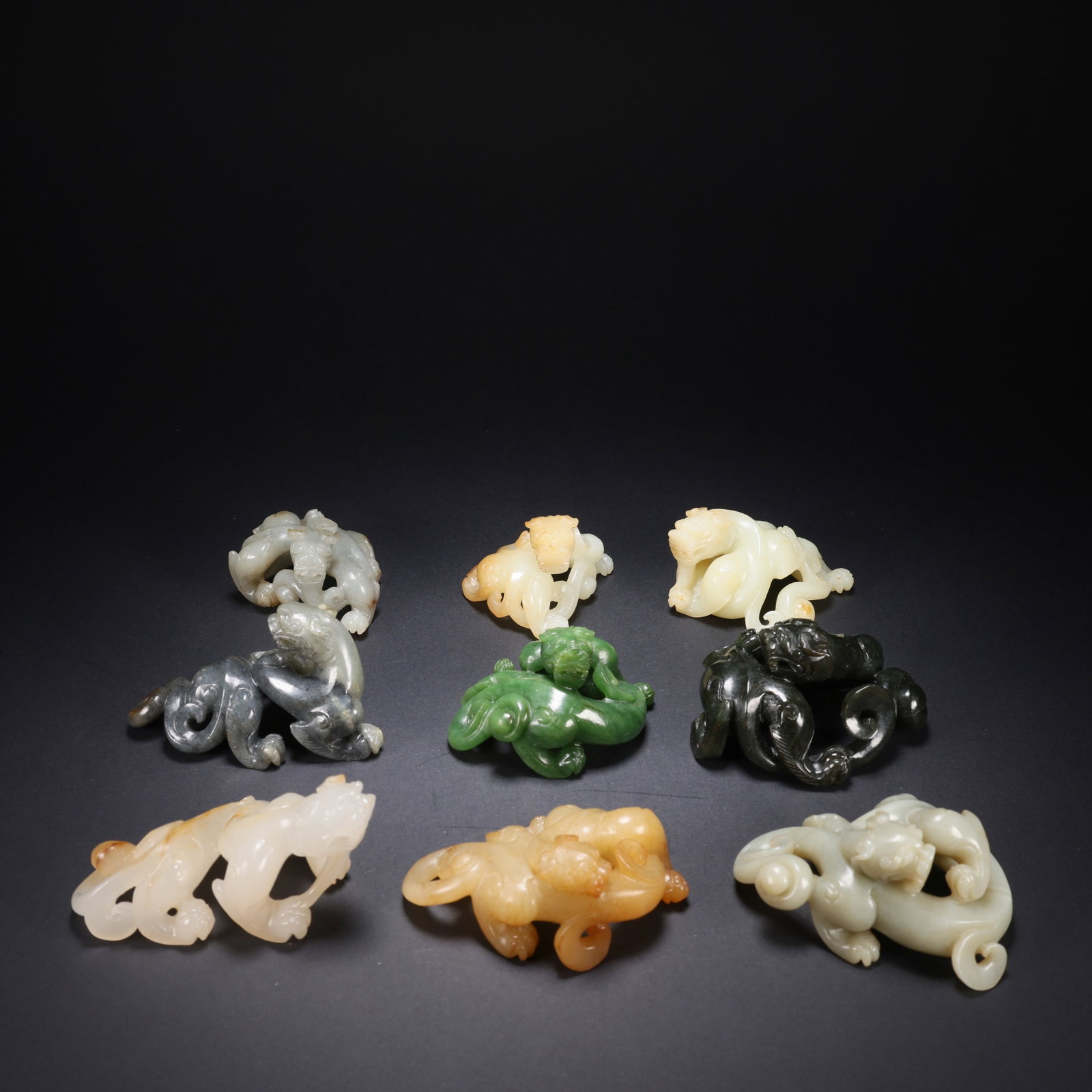 A HETIAN JADE NINE CH'I AUSPICIOUS DESIGN: Hetian Jade Nine Ch'i Auspicious Design