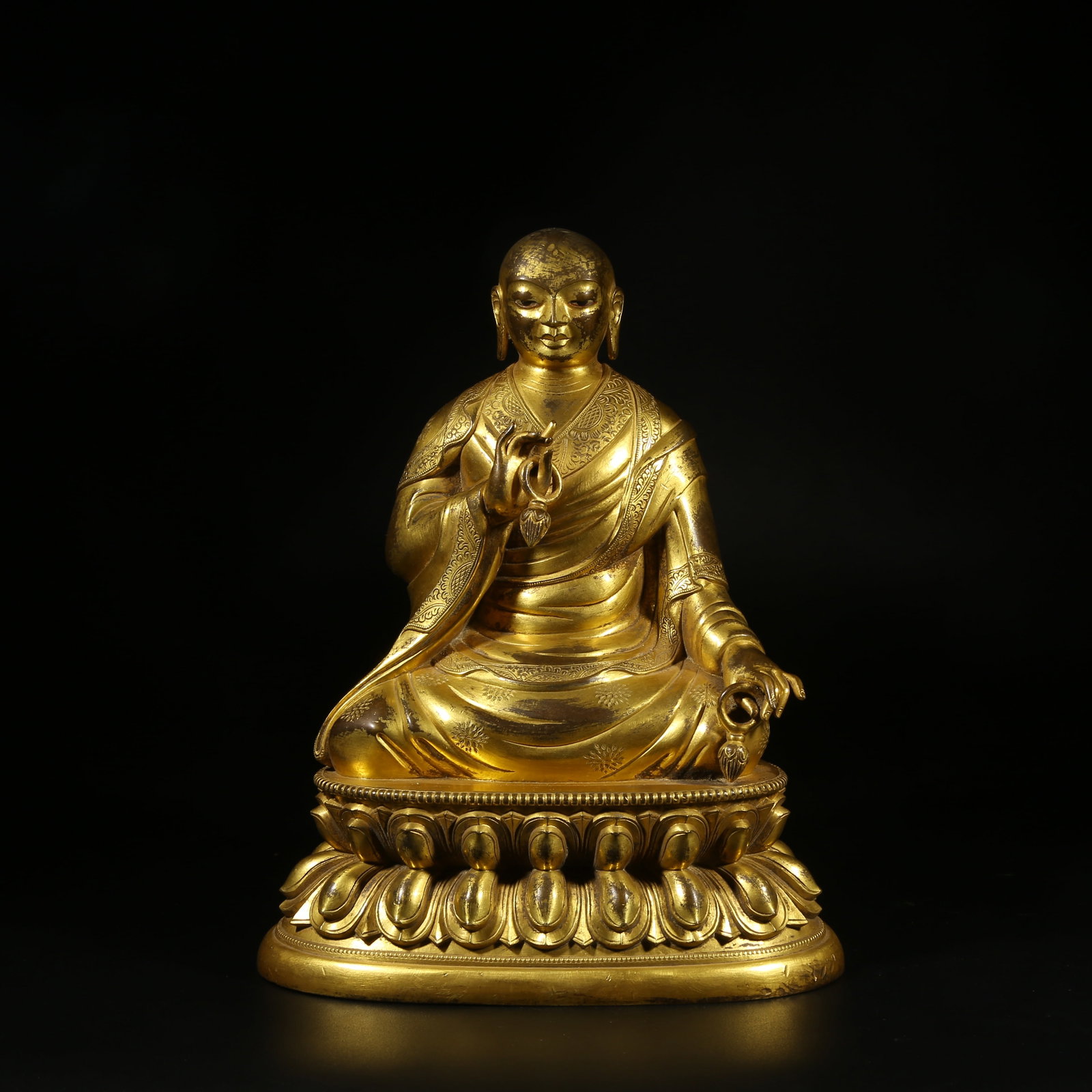A GILT-BRONZE STATUE OF AN ARHAT (1 of 8)