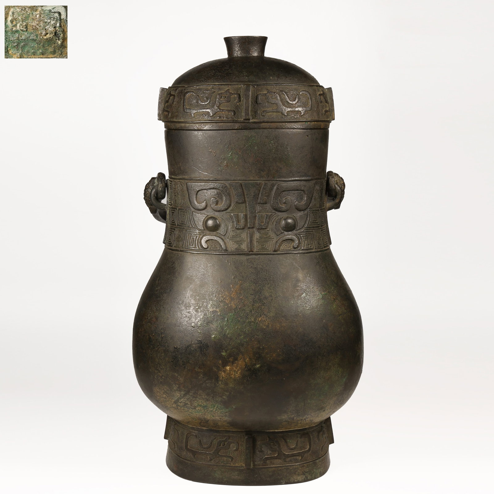 A BRONZE YOU VESSEL WITH ANIMAL-FACE MOTIFS AND UPRIGHT FINIALS (1 of 10)