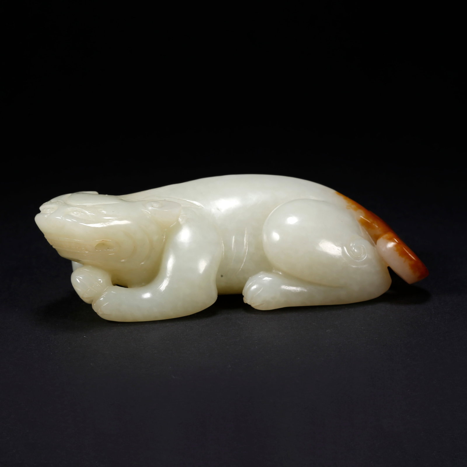 A HETIAN JADE BEAST-SHAPED FIGURINE (1 of 10)