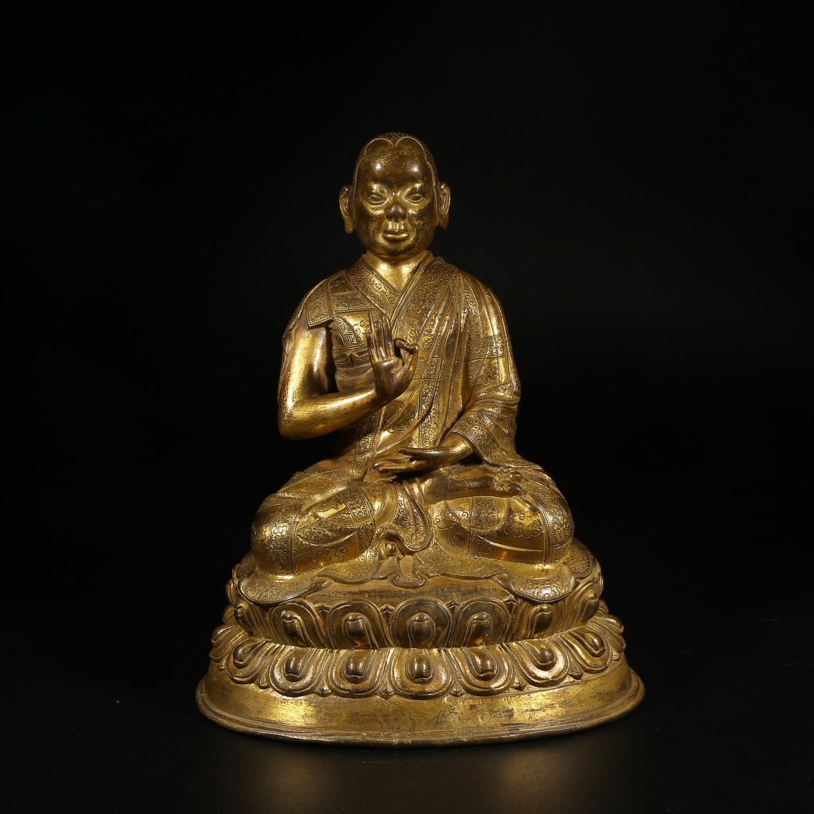 A GILT-BRONZE STATUE OF A GURU (1 of 8)