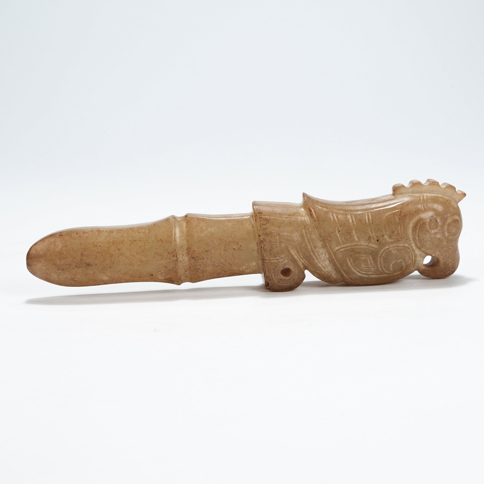 A ARCHAIC JADE PHOENIX-HEAD HANDLE-SHAPED ARTIFACT (1 of 8)