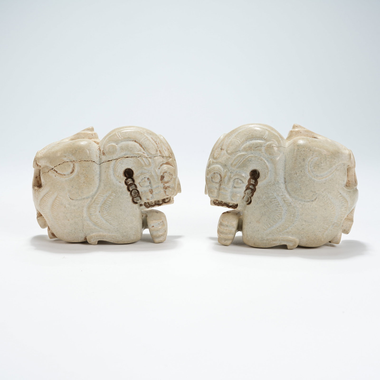 A SET OF ARCHAIC JADE RECLINING BEASTS (1 of 7)