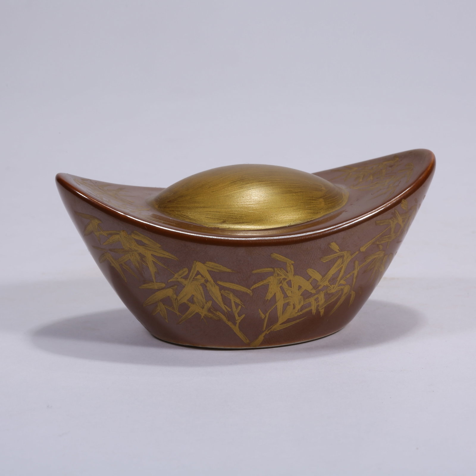 A JIHONG GLAZE GILDED INGOT-SHAPED PAPERWEIGHT (1 of 9)