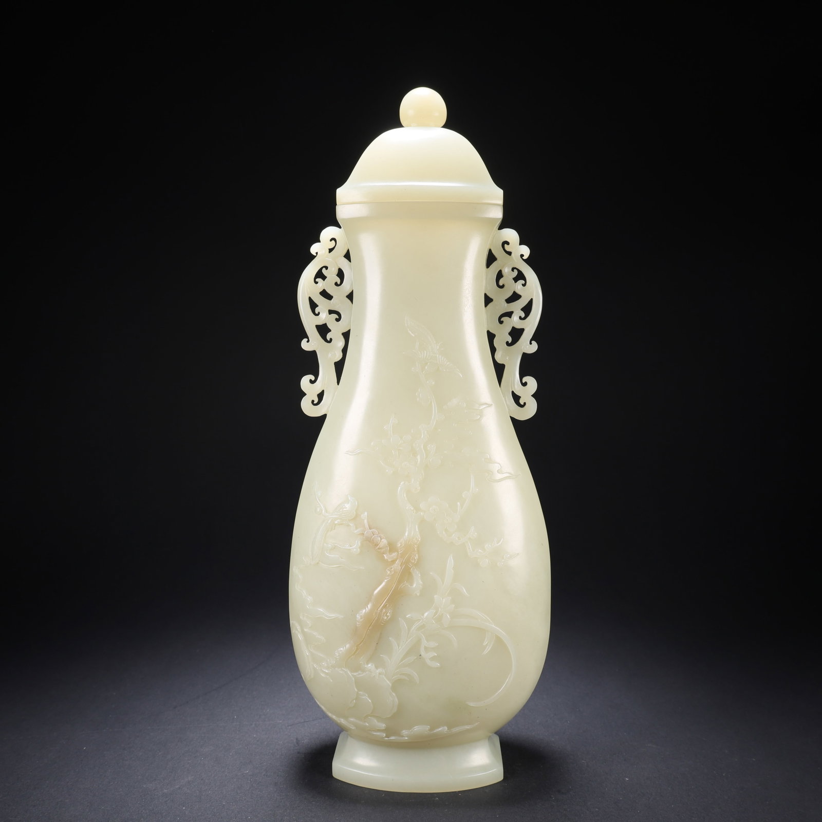 A HETIAN JADE PLUM, ORCHID, BAMBOO, CHRYSANTHEMUM, AND FLOWER-BIRD COVERED BOTTLE (1 of 9)