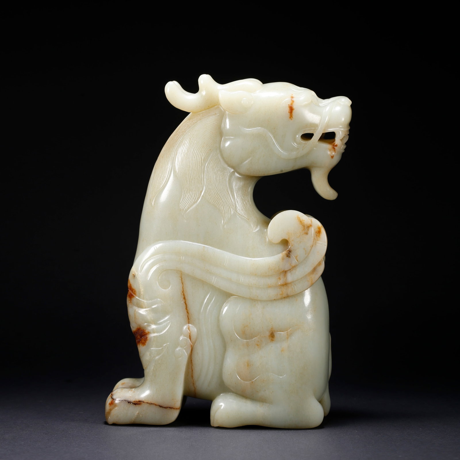 A HETIAN JADE AUSPICIOUS BEAST-SHAPED FIGURINE (1 of 9)