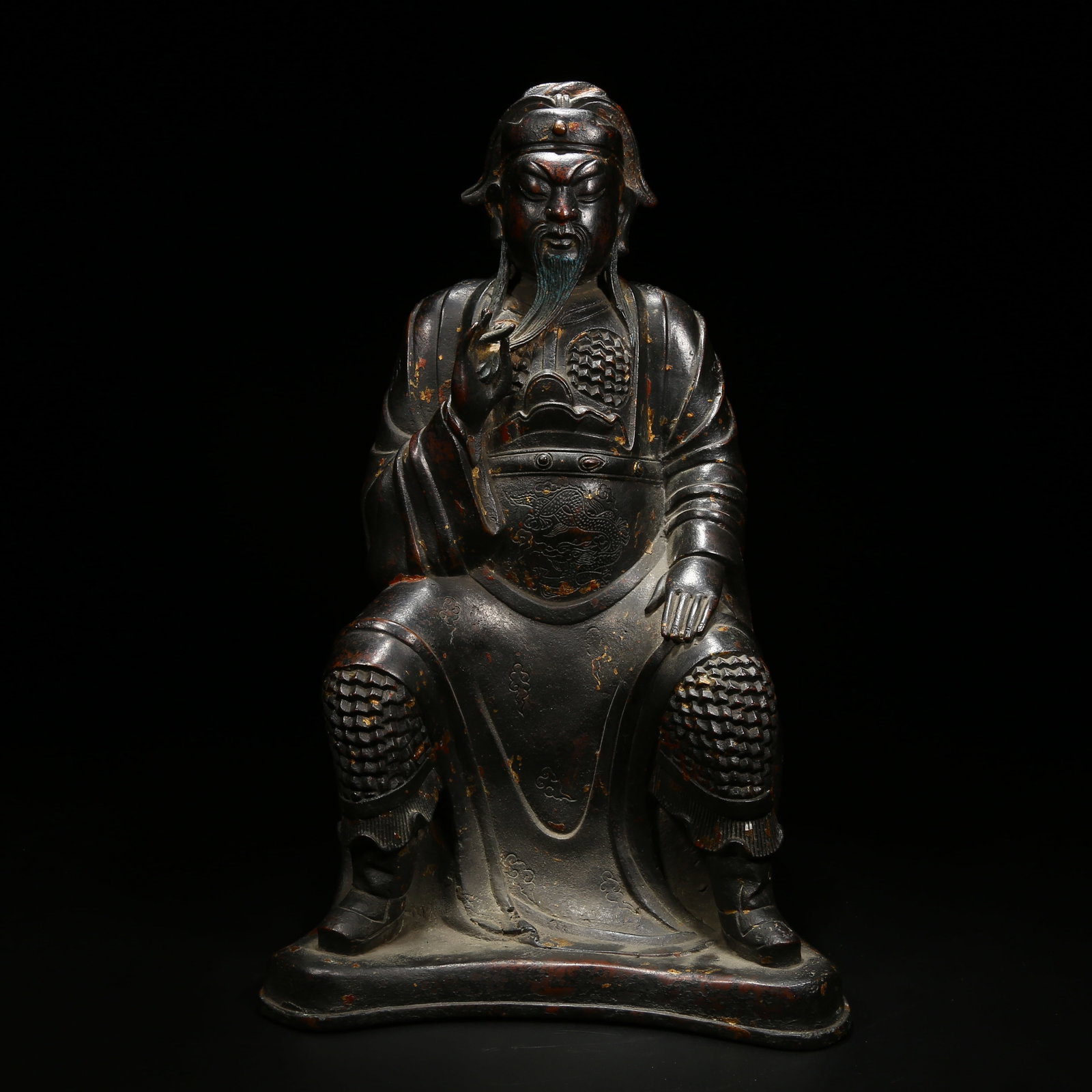 A BRONZE SEATED STATUE OF GUAN YU: Bronze seated statue of Guan Yu
