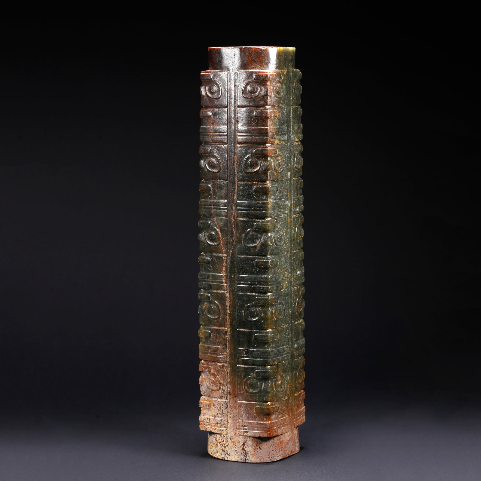 A ANCIENT JADE CONG WITH BEAST FACE MOTIF: Ancient Jade Cong with Beast Face Motif