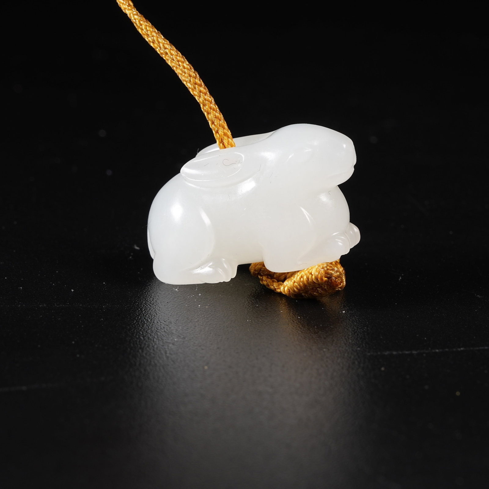 A HETIAN WHITE JADE RECUMBENT RABBIT PENDANT (1 of 8)