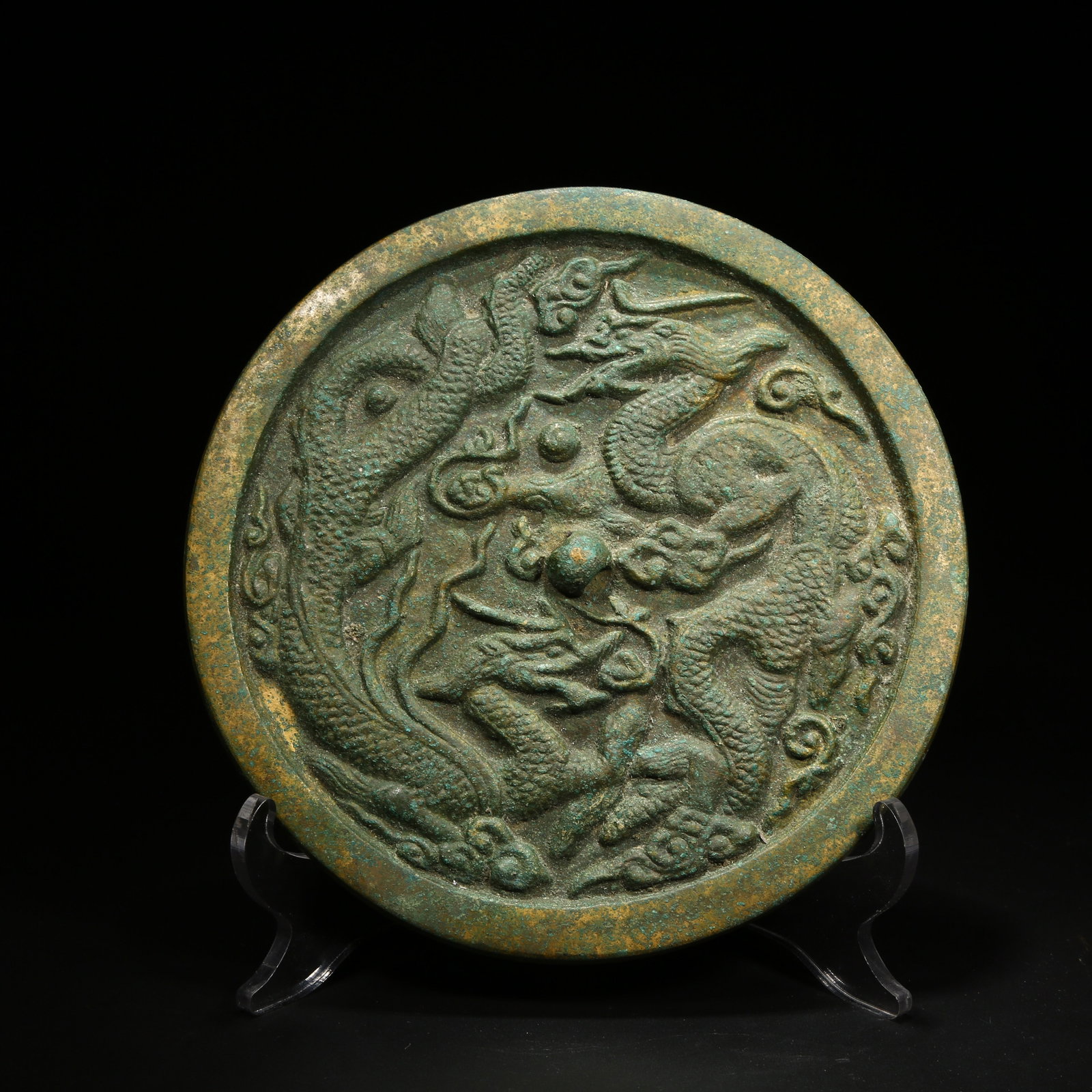 A BRONZE MIRROR WITH CLOUD AND DRAGON DESIGN (1 of 8)