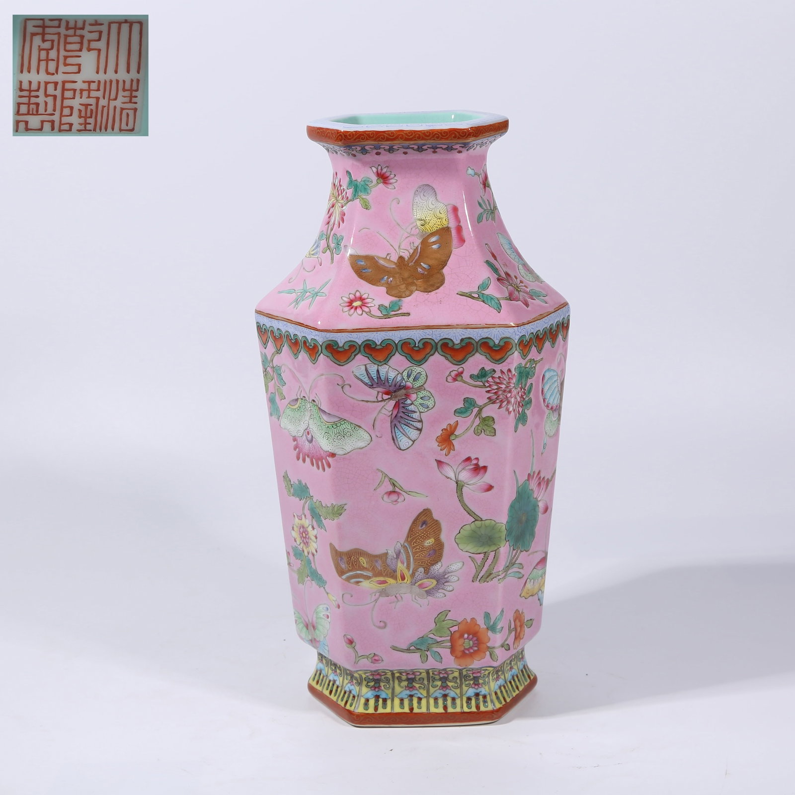 A PALACE-PINK GROUND FAMILLE ROSE FLORAL AND BUTTERFLY PATTERN HEXAGONAL VASE (1 of 9)