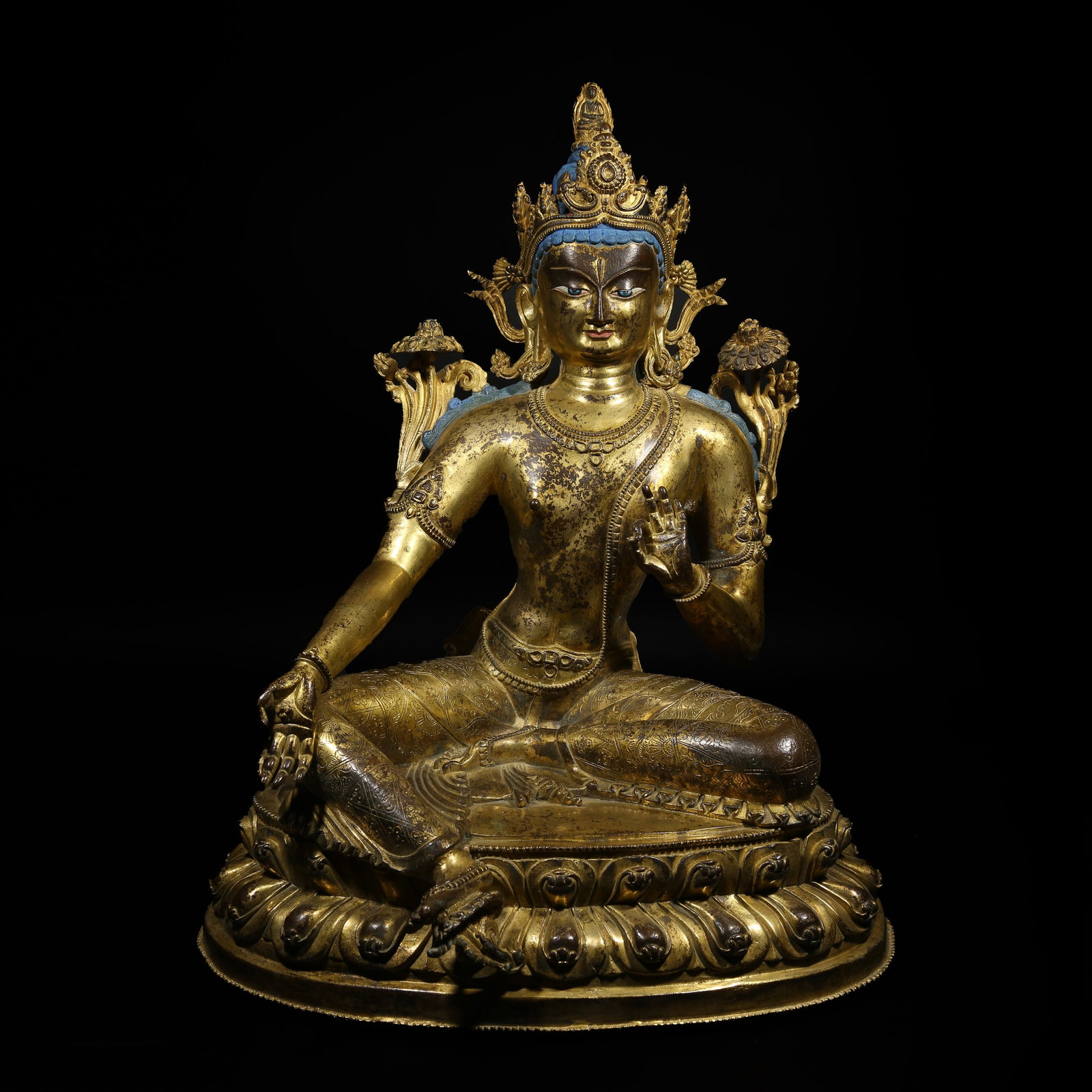 A GILT-BRONZE STATUE OF GREEN TARA: Gilt-Bronze Statue of Green Tara