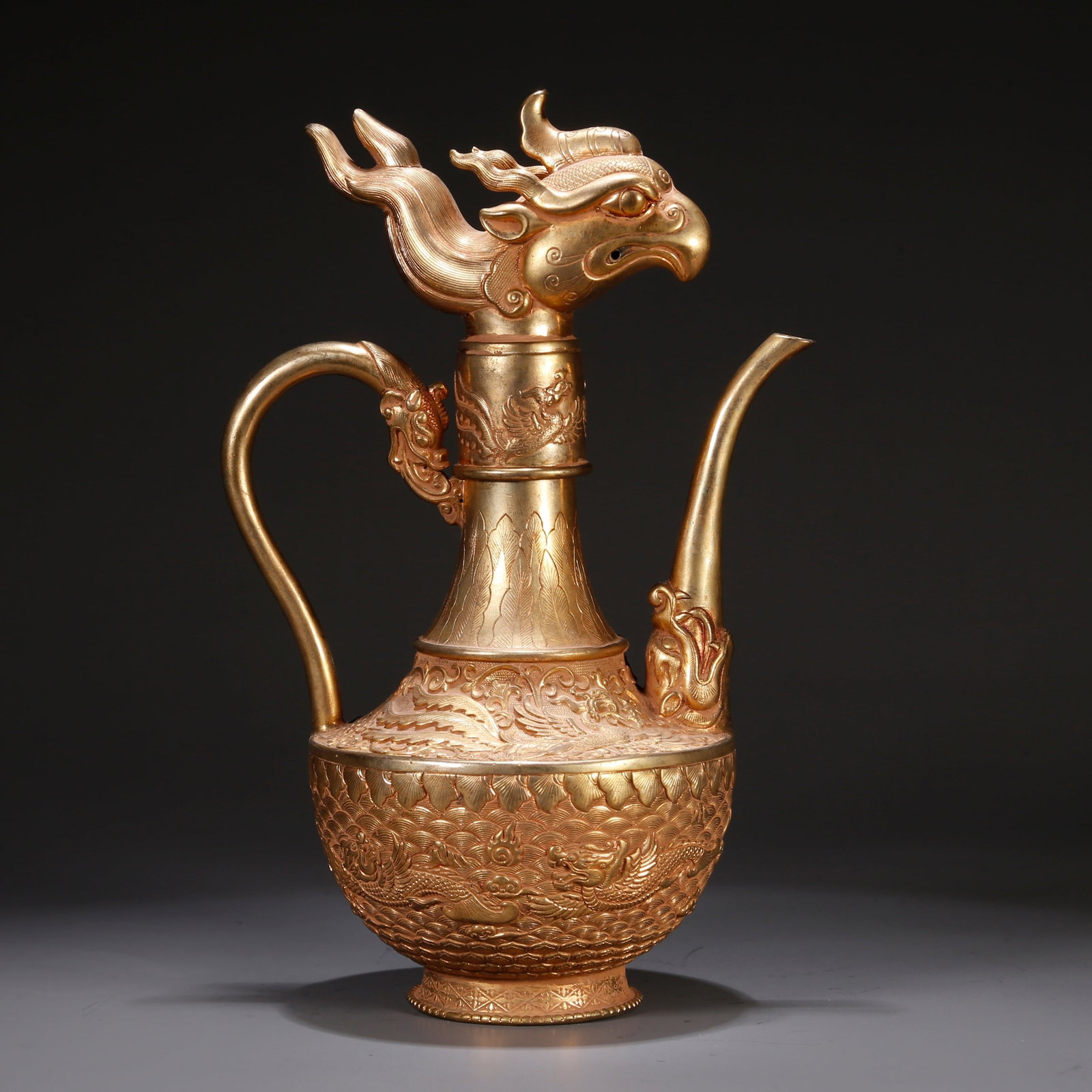 A GILT BRONZE EWER WITH PHOENIX-HEAD SPOUT: Gilt bronze ewer with phoenix-head spout