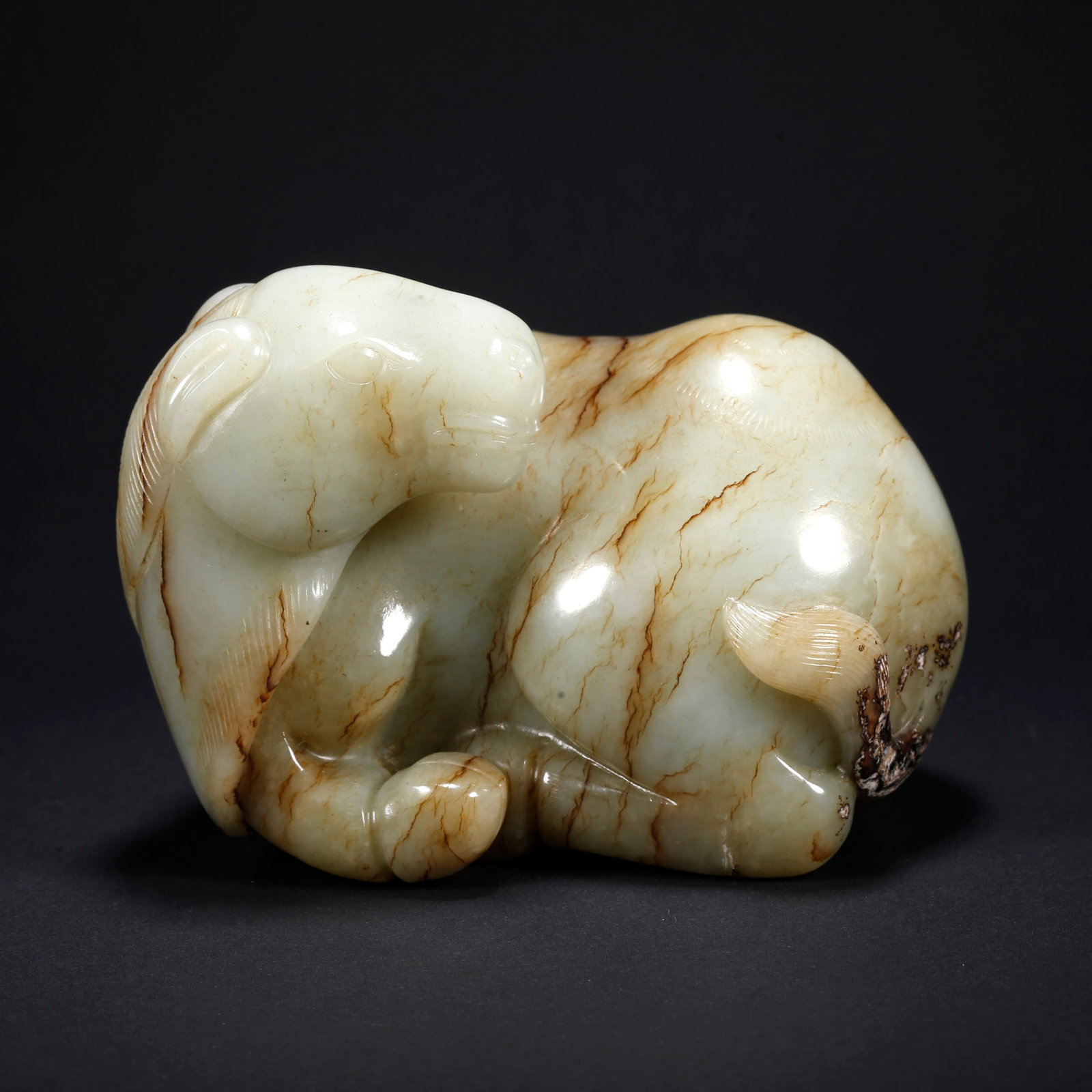 A HETIAN JADE CAMEL-SHAPED FIGURINE (1 of 9)