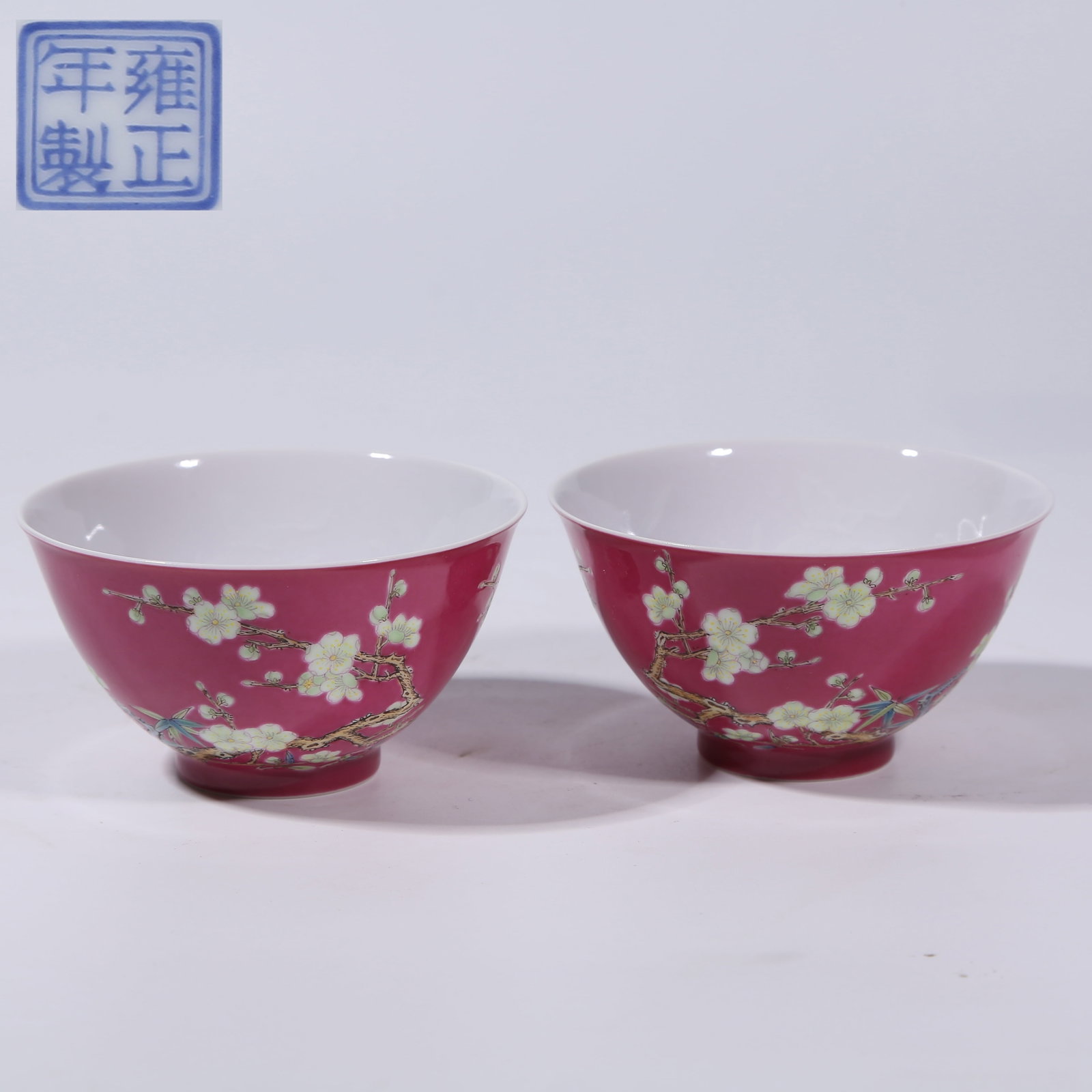 A ROUGE DE FER GROUND ENAMEL FAMILLE ROSE PLUM BLOSSOM PATTERN CUP SET (1 of 9)