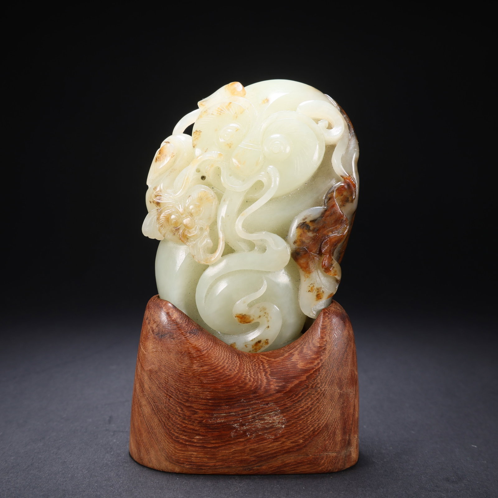 A HETIAN JADE WOOD-BASE POLYCHROME LINGZHI RUYI FIGURINE (1 of 9)