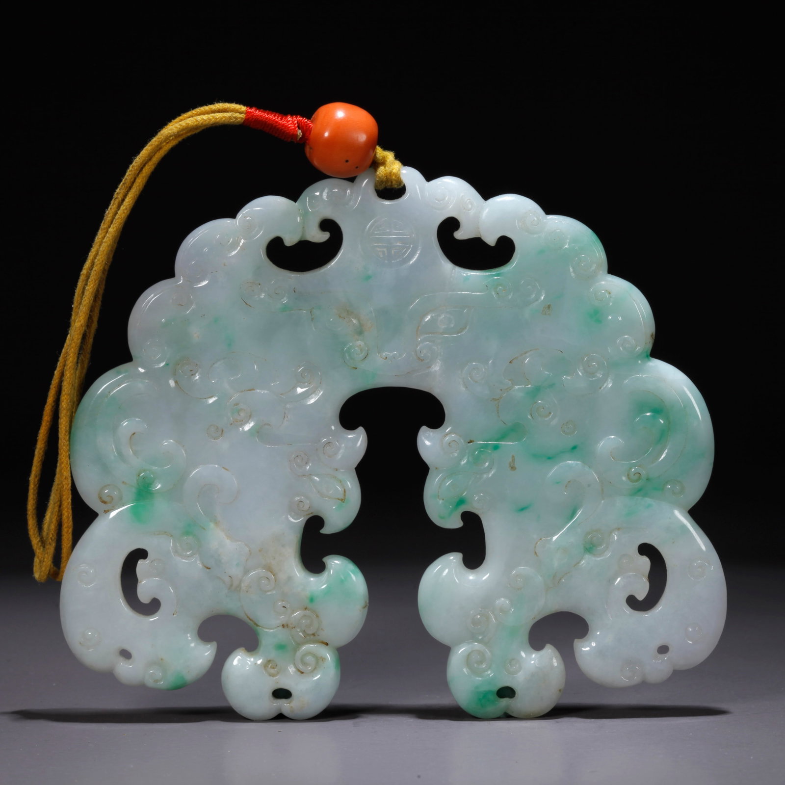 A JADEITE PENDANT WITH BEAST FACE MOTIF (1 of 10)