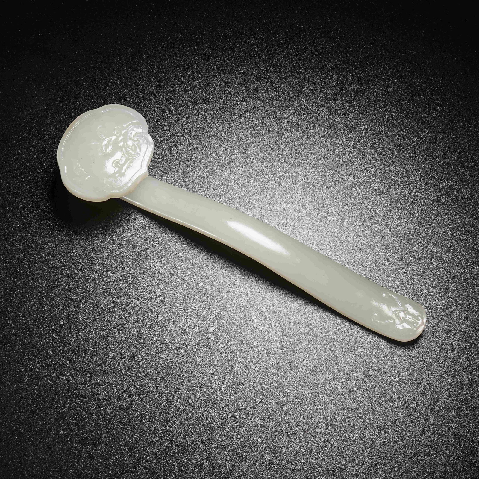 A HETIAN JADE RUYI SCEPTER WITH LONGEVITY PEACH MOTIF: Hetian Jade Ruyi Scepter with Longevity Peach Motif