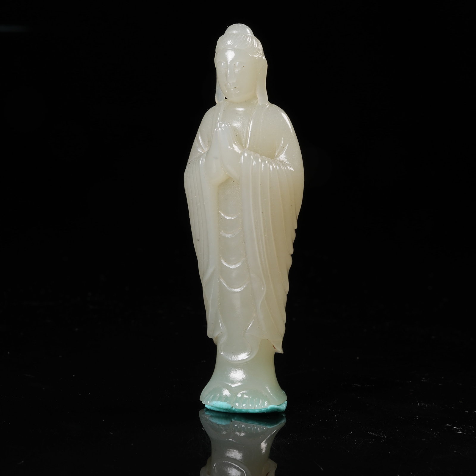 A HETIAN JADE STANDING FIGURE OF SHAKYAMUNI: Hetian Jade Standing Figure of Shakyamuni