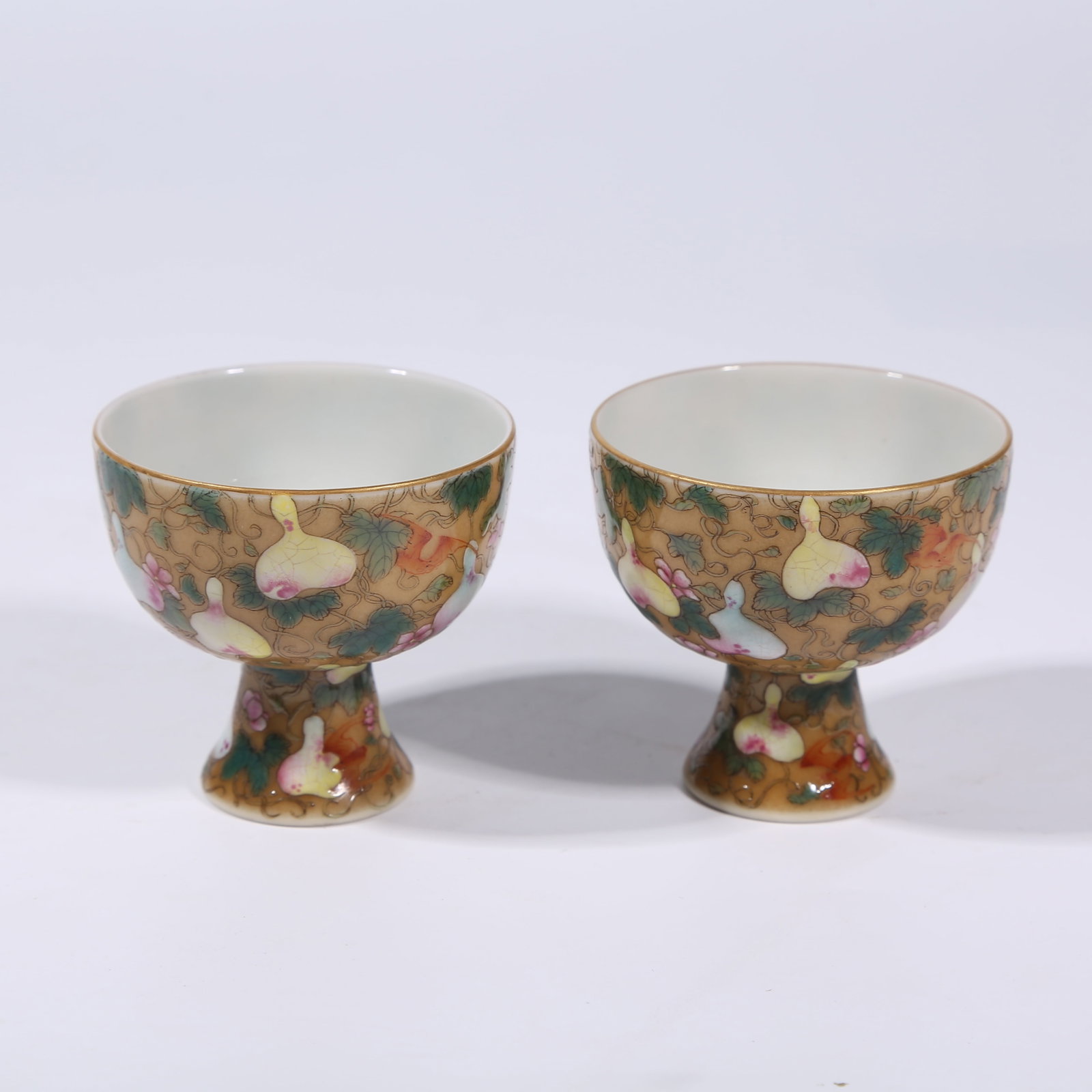 A YELLOW-GROUND ENAMEL FAMILLE ROSE "FORTUNE AND LONGEVITY FOR TEN THOUSAND GENERATIONS" WINE CUP (1 of 9)