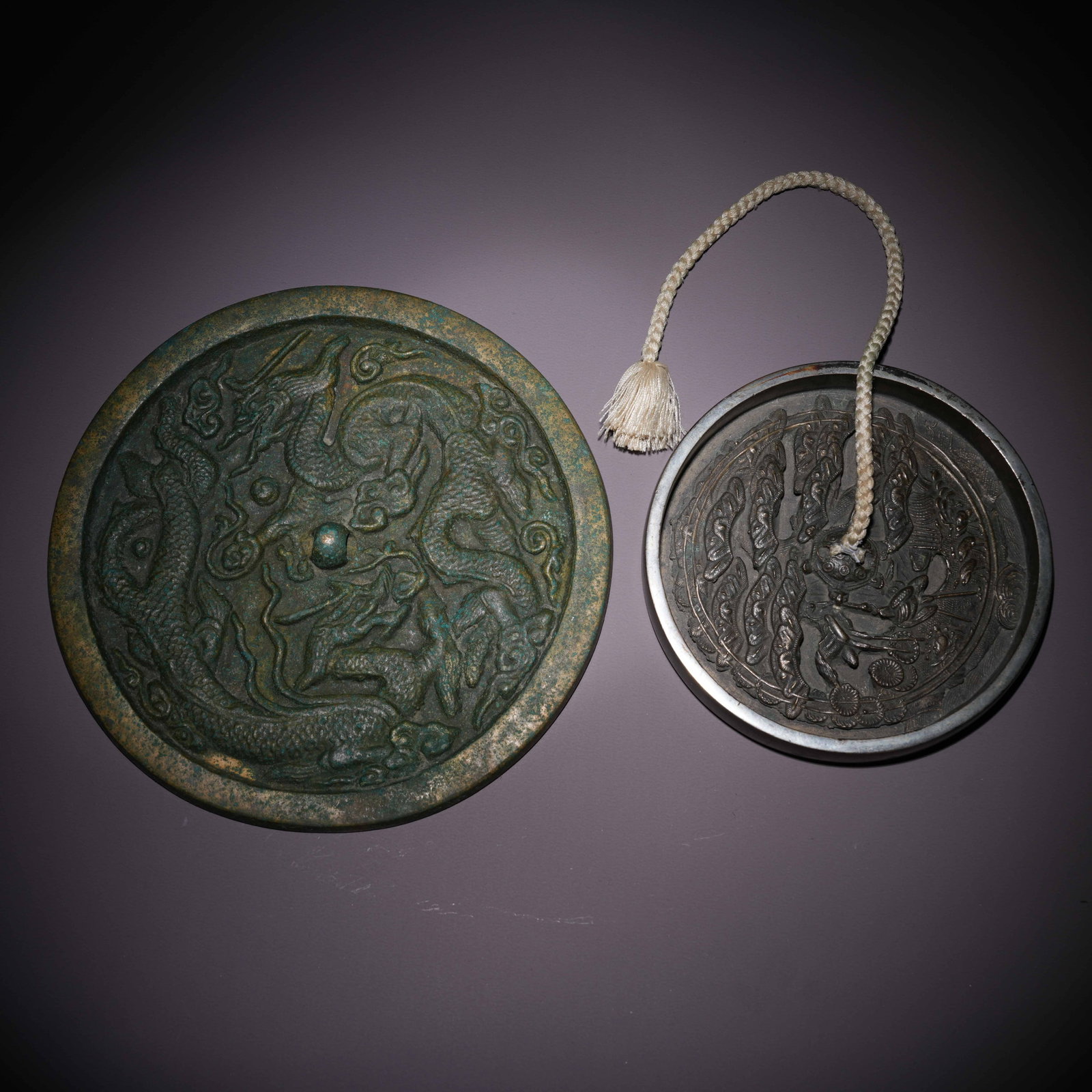 A SET OF BRONZE MIRRORS (1 of 9)