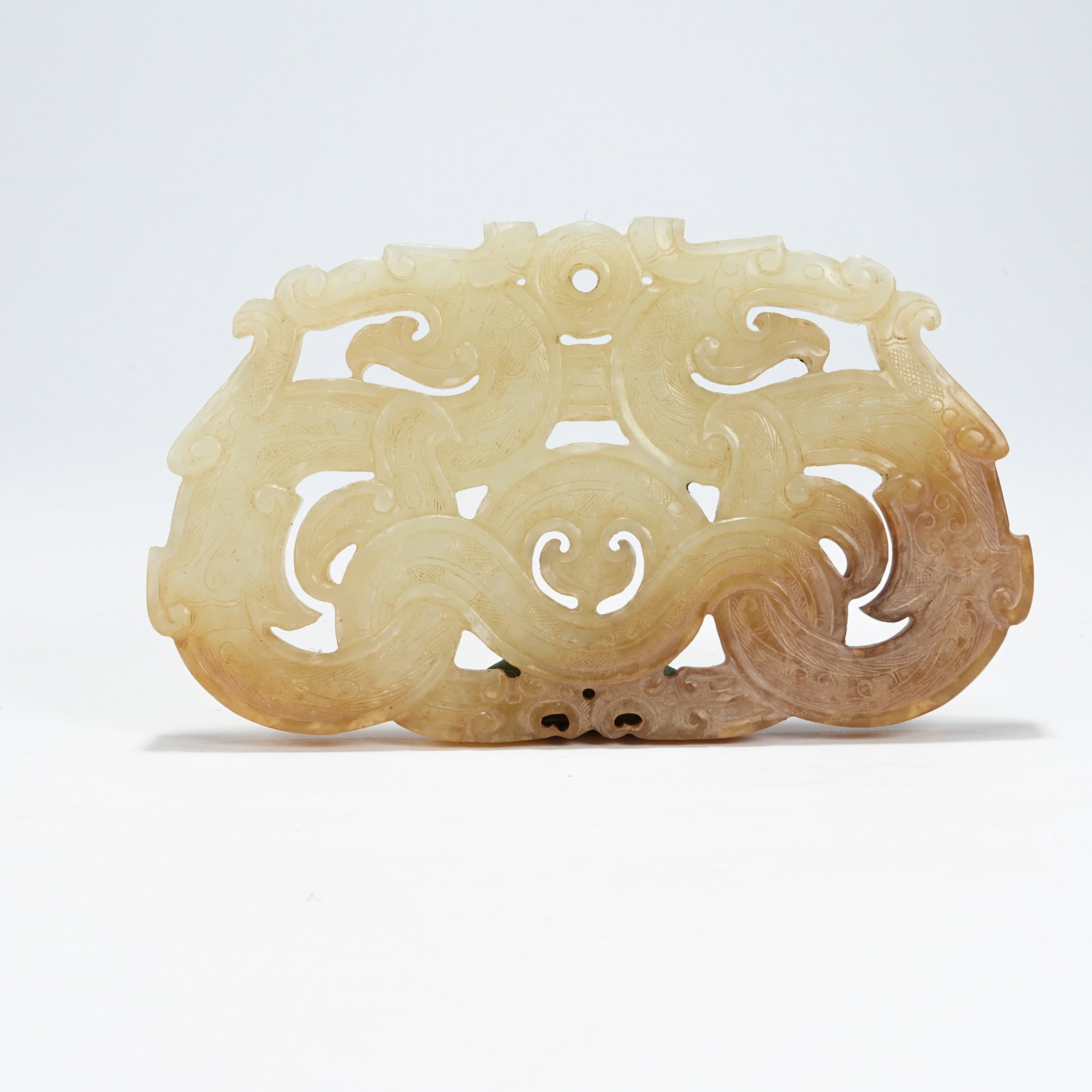 A ARCHAIC JADE DOUBLE-DRAGON PENDANT (1 of 8)