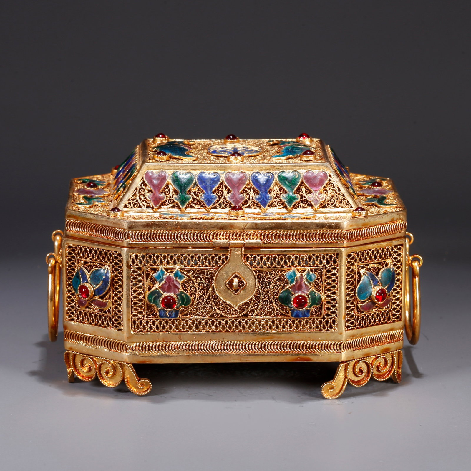 A GILT BRONZE LIDDED BOX WITH BLESSING AND LONGEVITY MOTIFS: Gilt bronze lidded box with blessing and longevity motifs