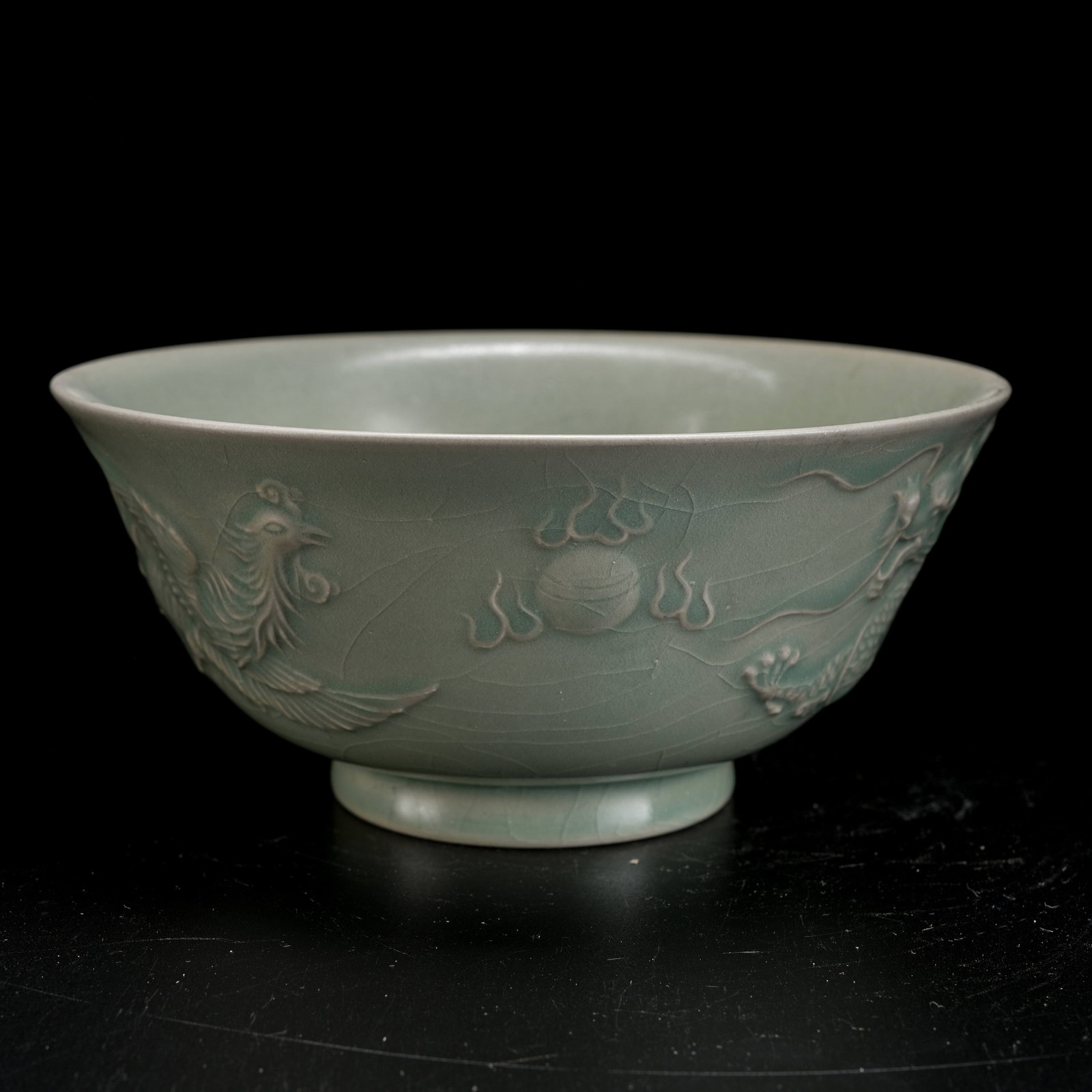 A RU KILN SCULPTED BOWL WITH DRAGON AND PHOENIX MOTIF: Ru Kiln Sculpted Bowl with Dragon and Phoenix Motif
